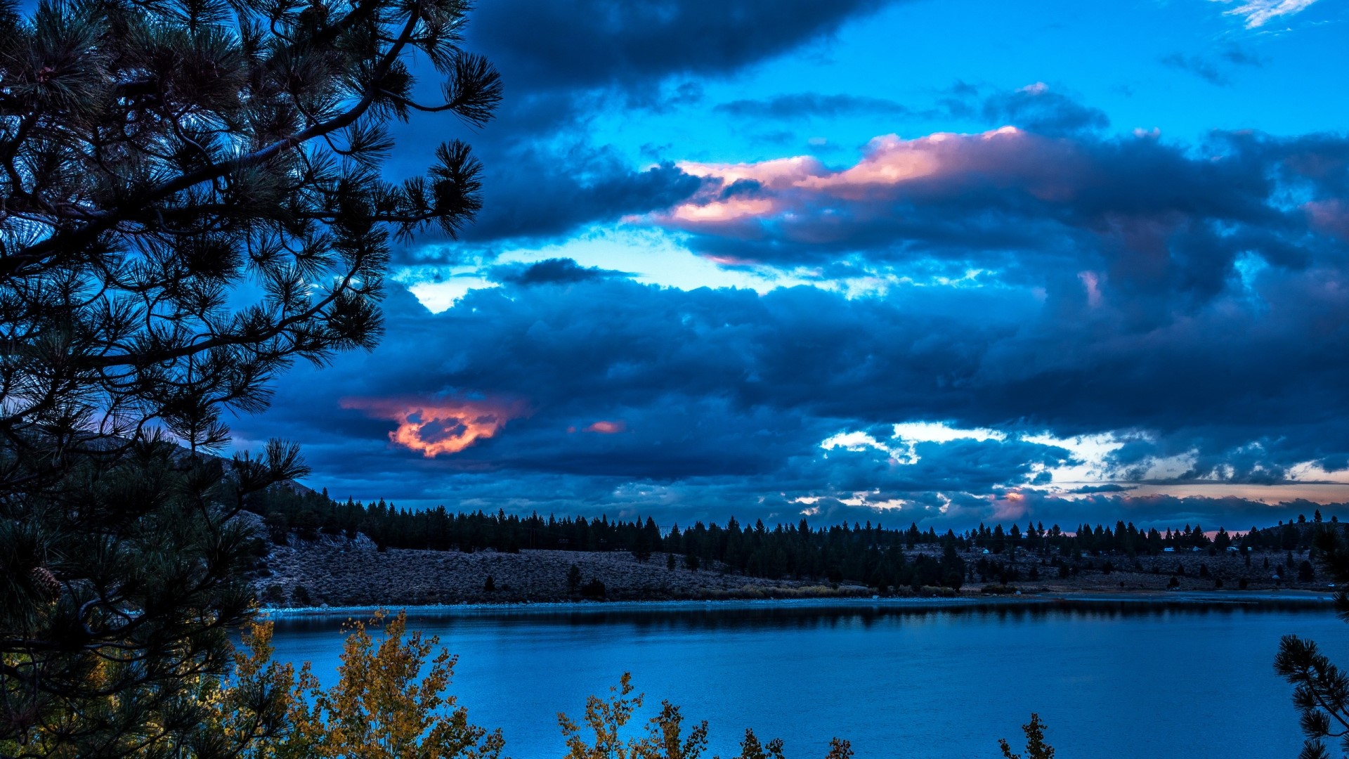 Dark Clouds Over a Lake at Dusk HD Wallpaper