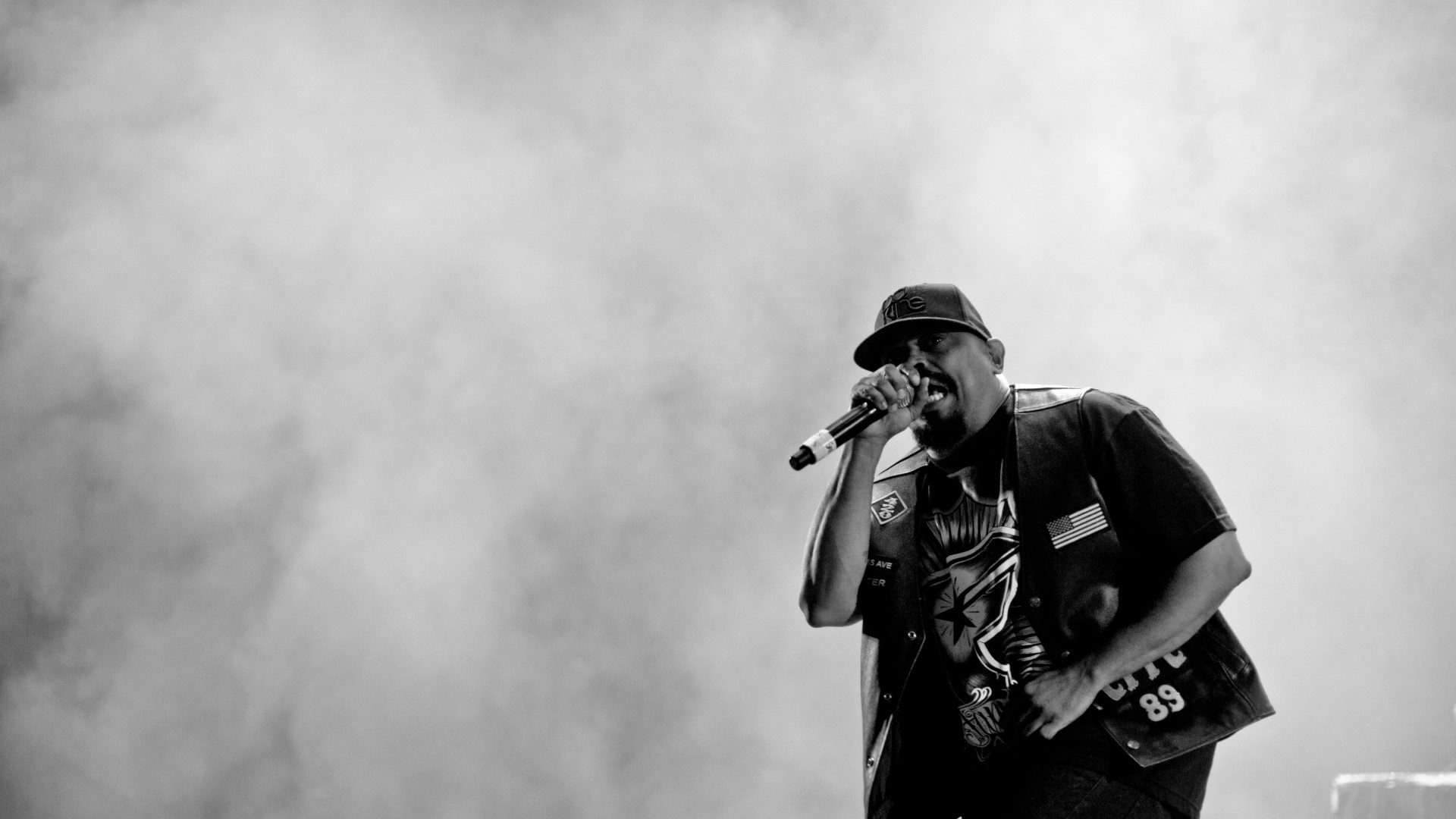 Rapper performing on stage with smoke HD Wallpaper