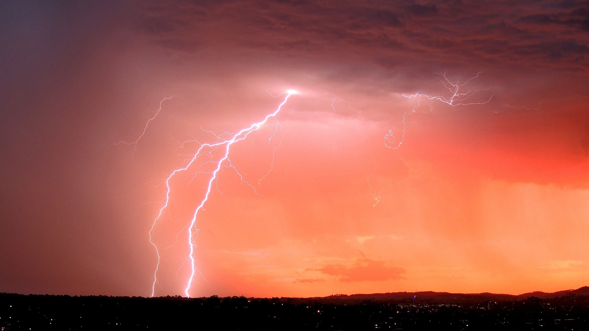 Lightning strike over a dark landscape HD Wallpaper