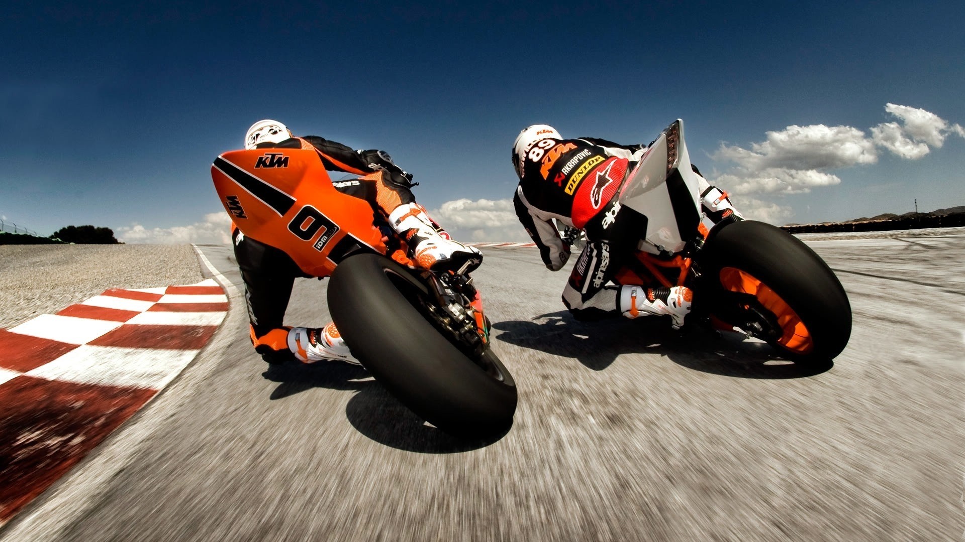 KTM motorcycles racing on a track HD Wallpaper