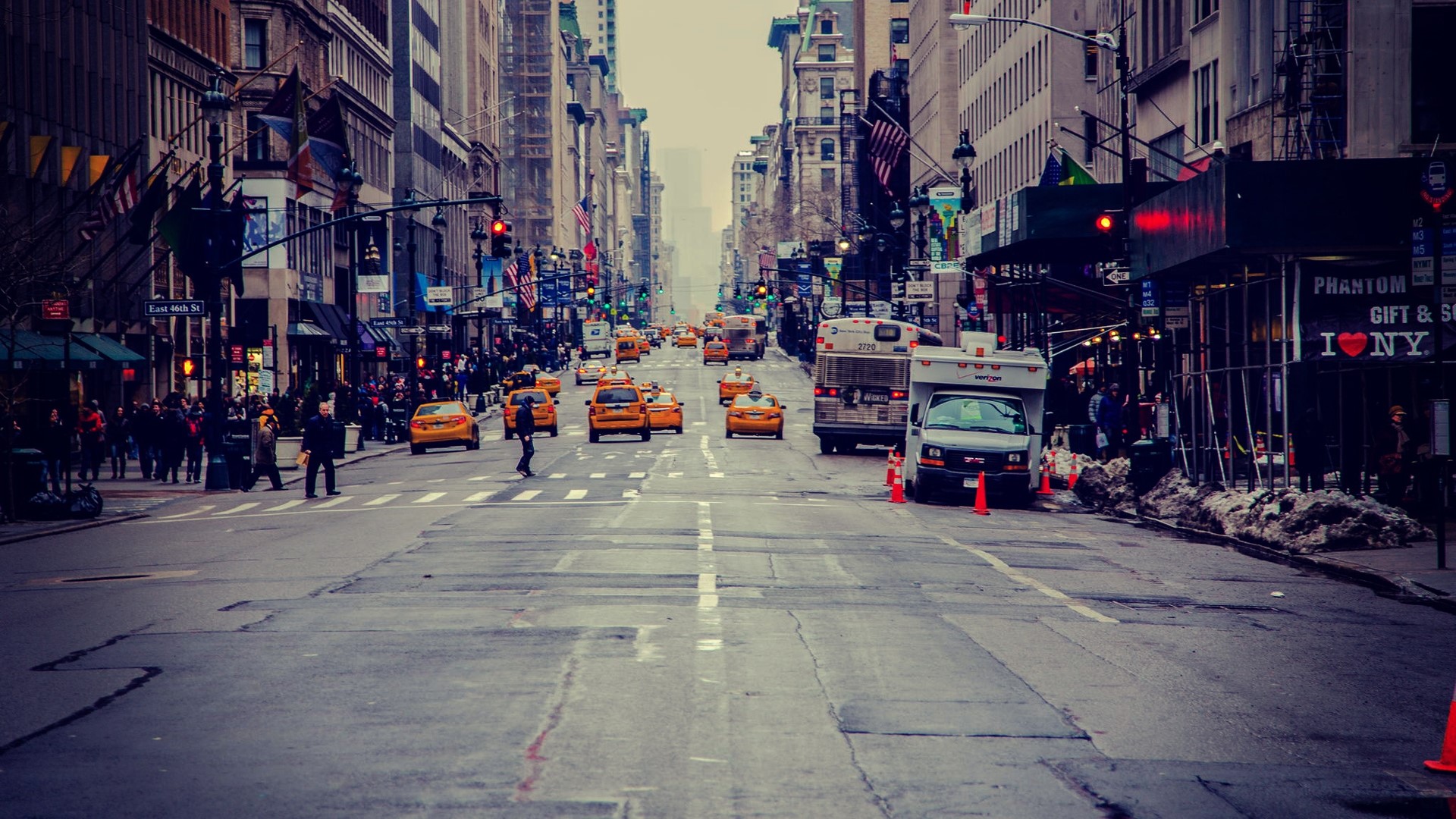 New York City street with yellow taxis and pedestrians HD Wallpaper