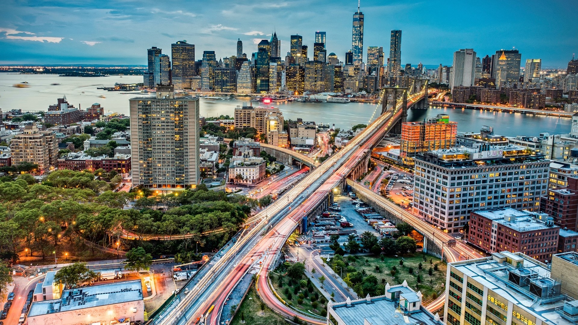 New York City Skyline with Brooklyn Bridge and Car Lights HD Wallpaper