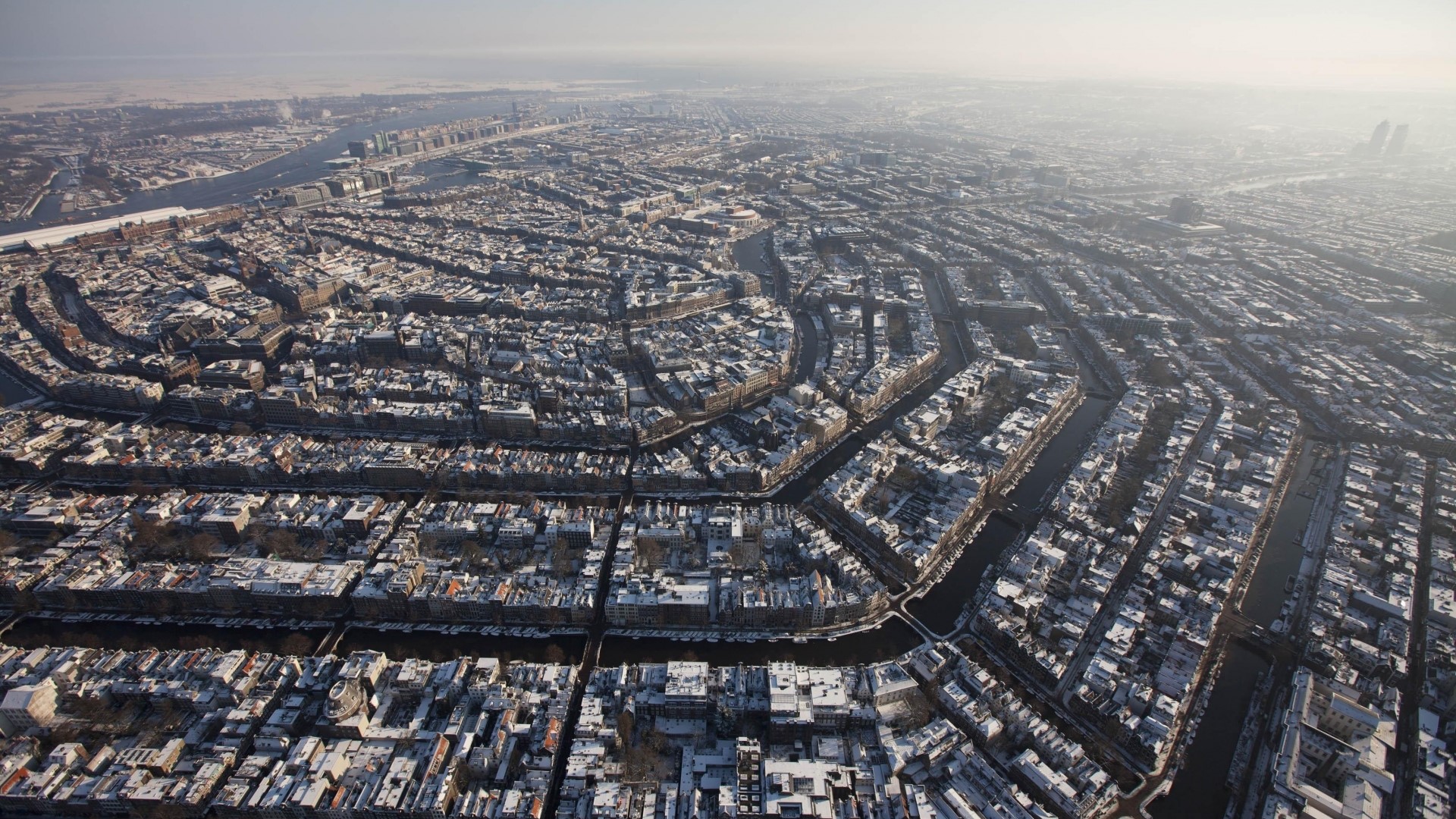 Amsterdam cityscape covered in snow HD Wallpaper