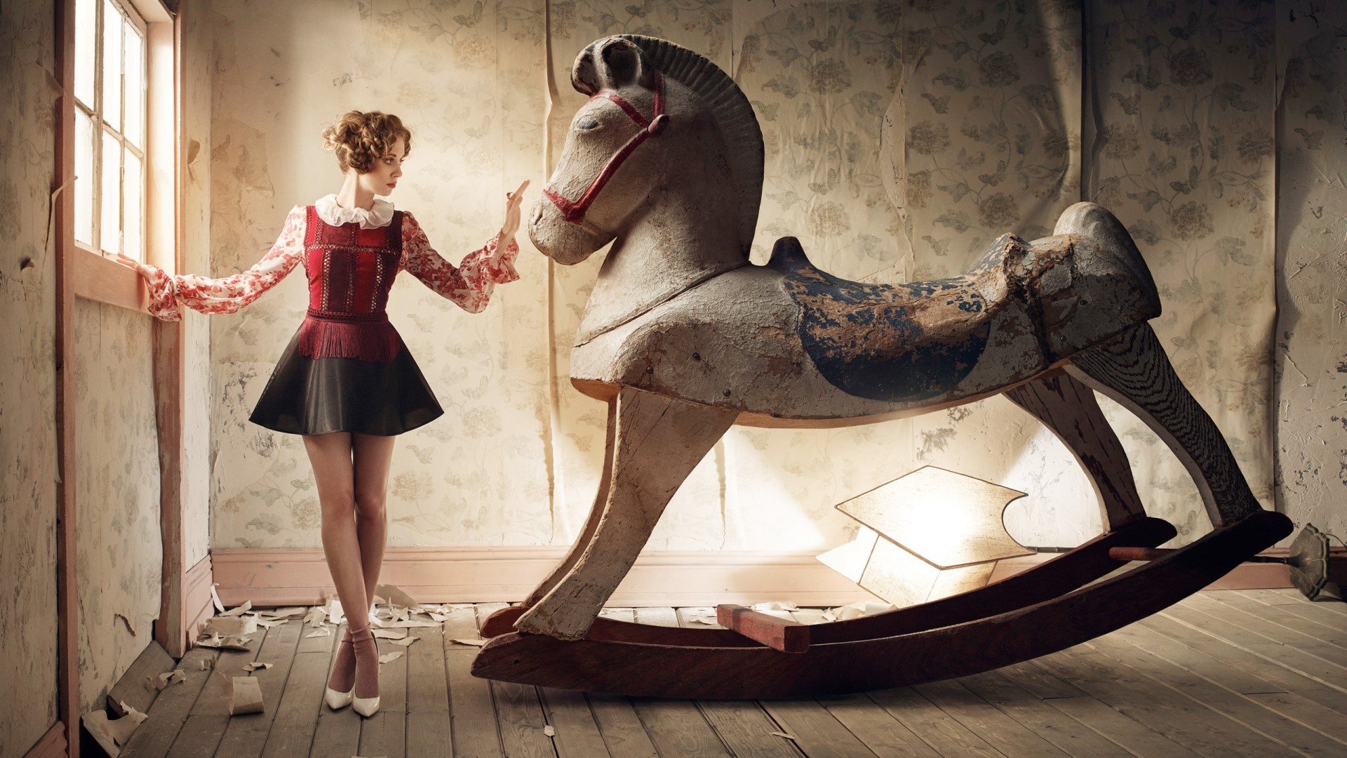Woman with rocking horse in abandoned room HD Wallpaper