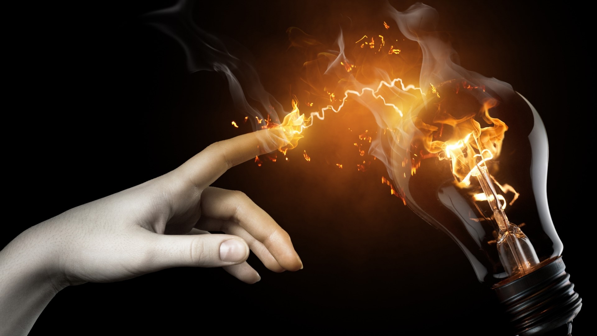 Finger touching a burning light bulb with sparks HD Wallpaper