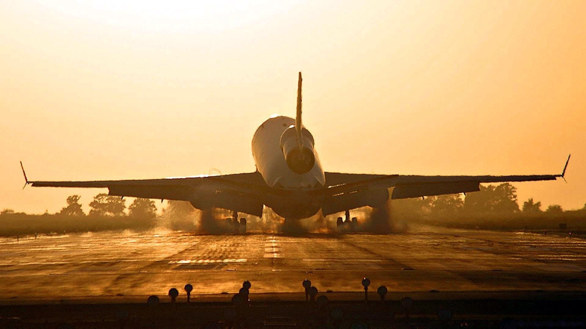 Airplane Landing at Sunset HD Wallpaper