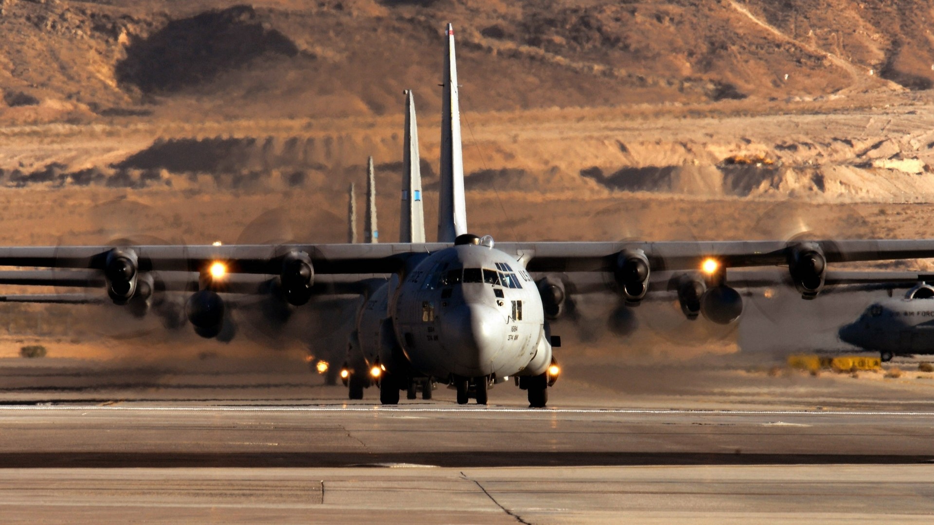 Lockheed C-130 Hercules aircraft on runway HD Wallpaper