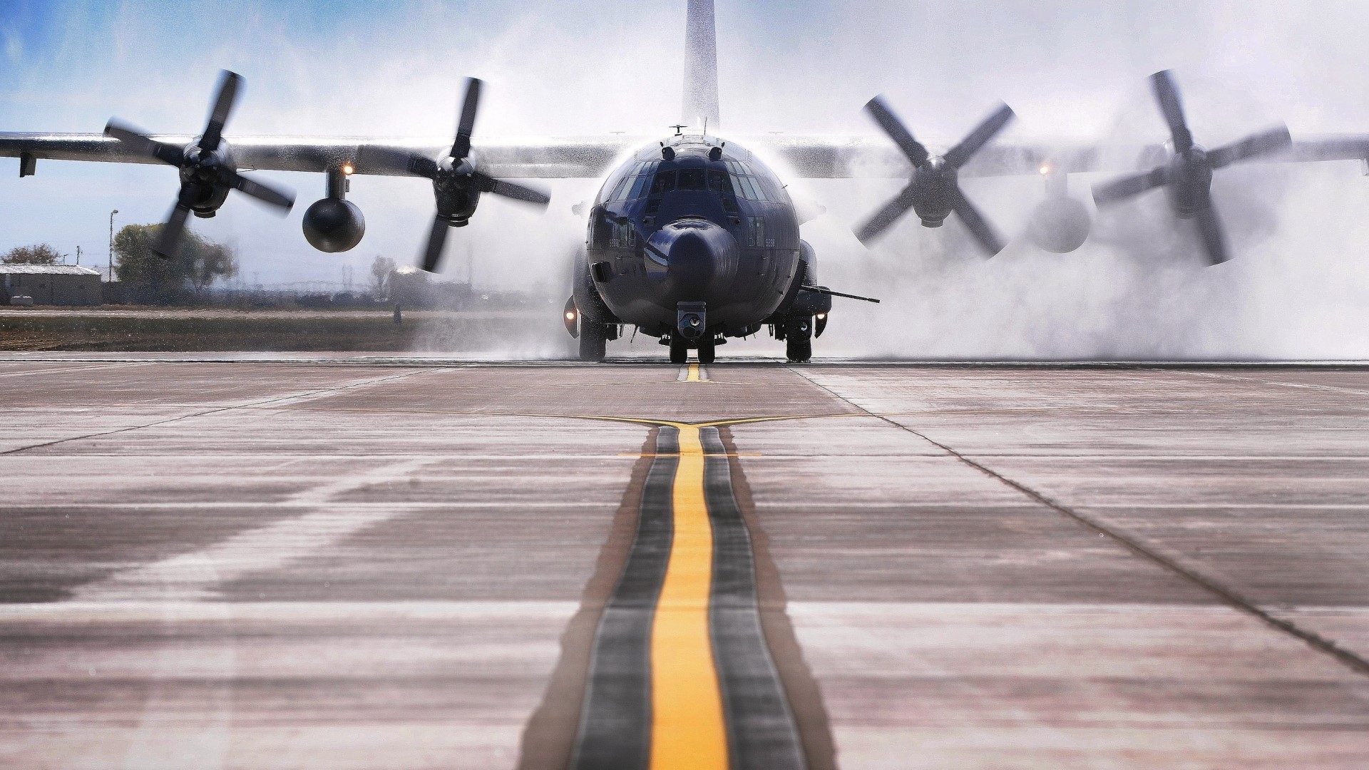 Lockheed C-130 Hercules on a wet runway HD Wallpaper