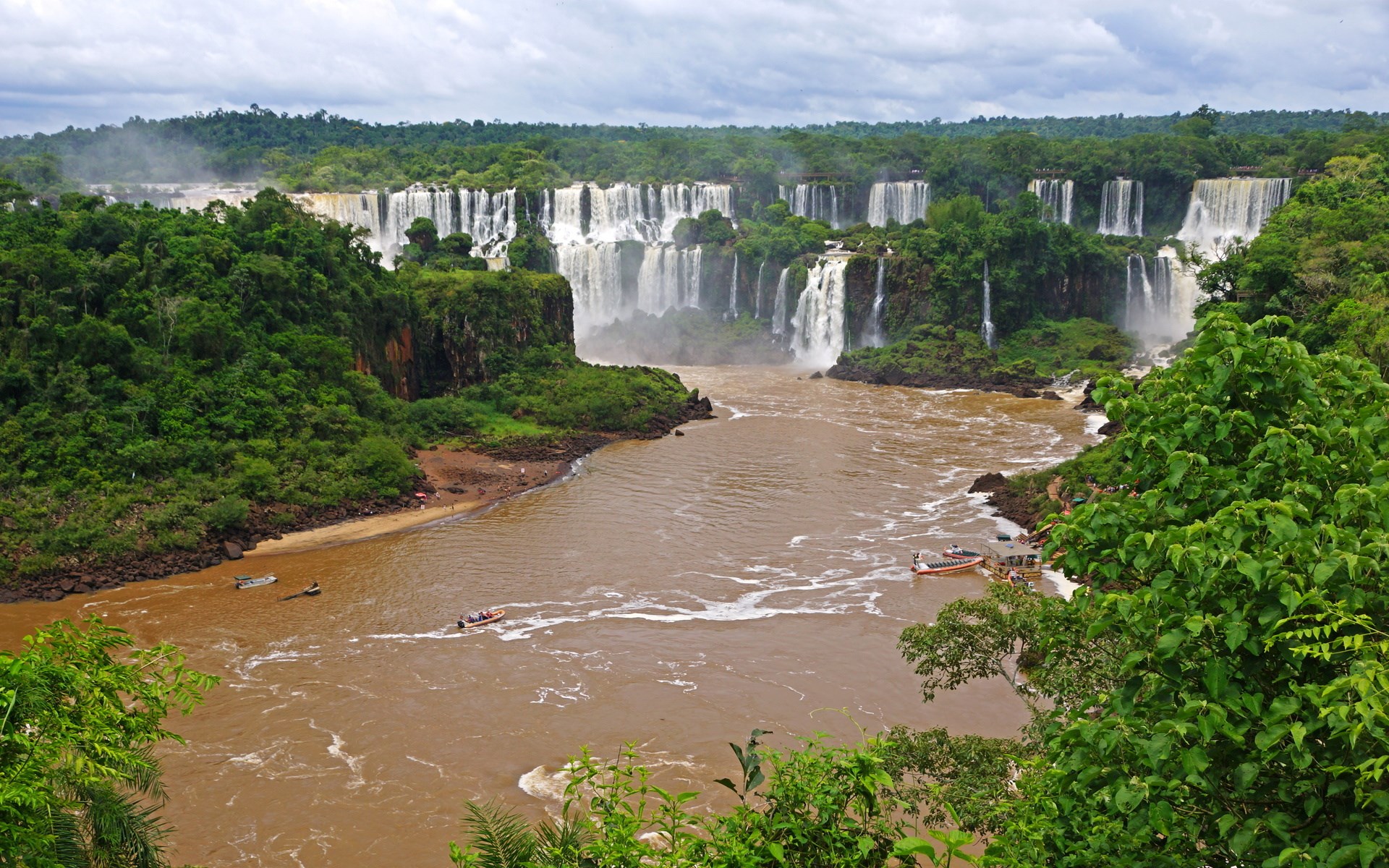 Iguazu Falls with boats on the river HD Wallpaper