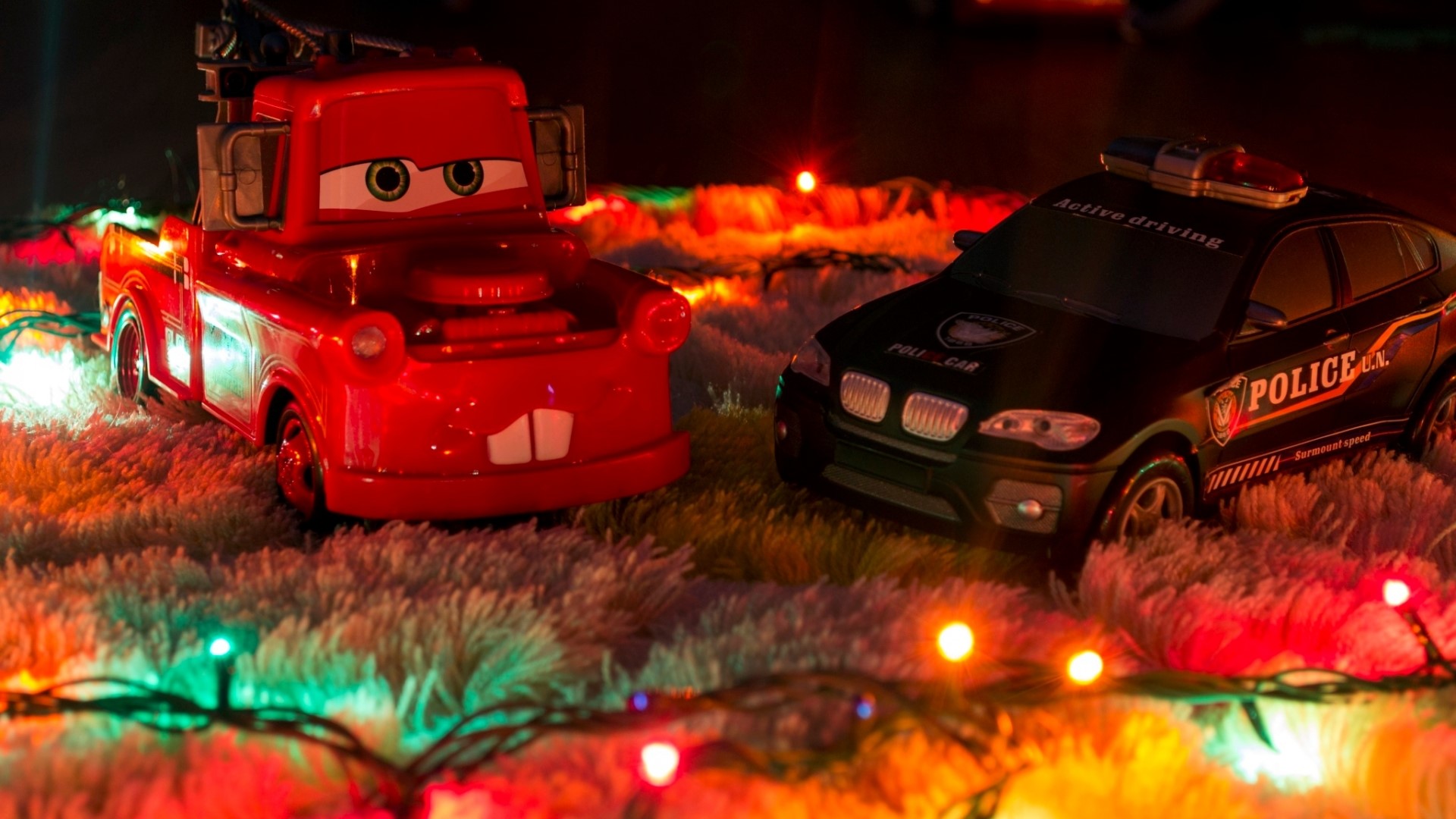 Mater and Police Car Toys with Christmas Lights HD Wallpaper