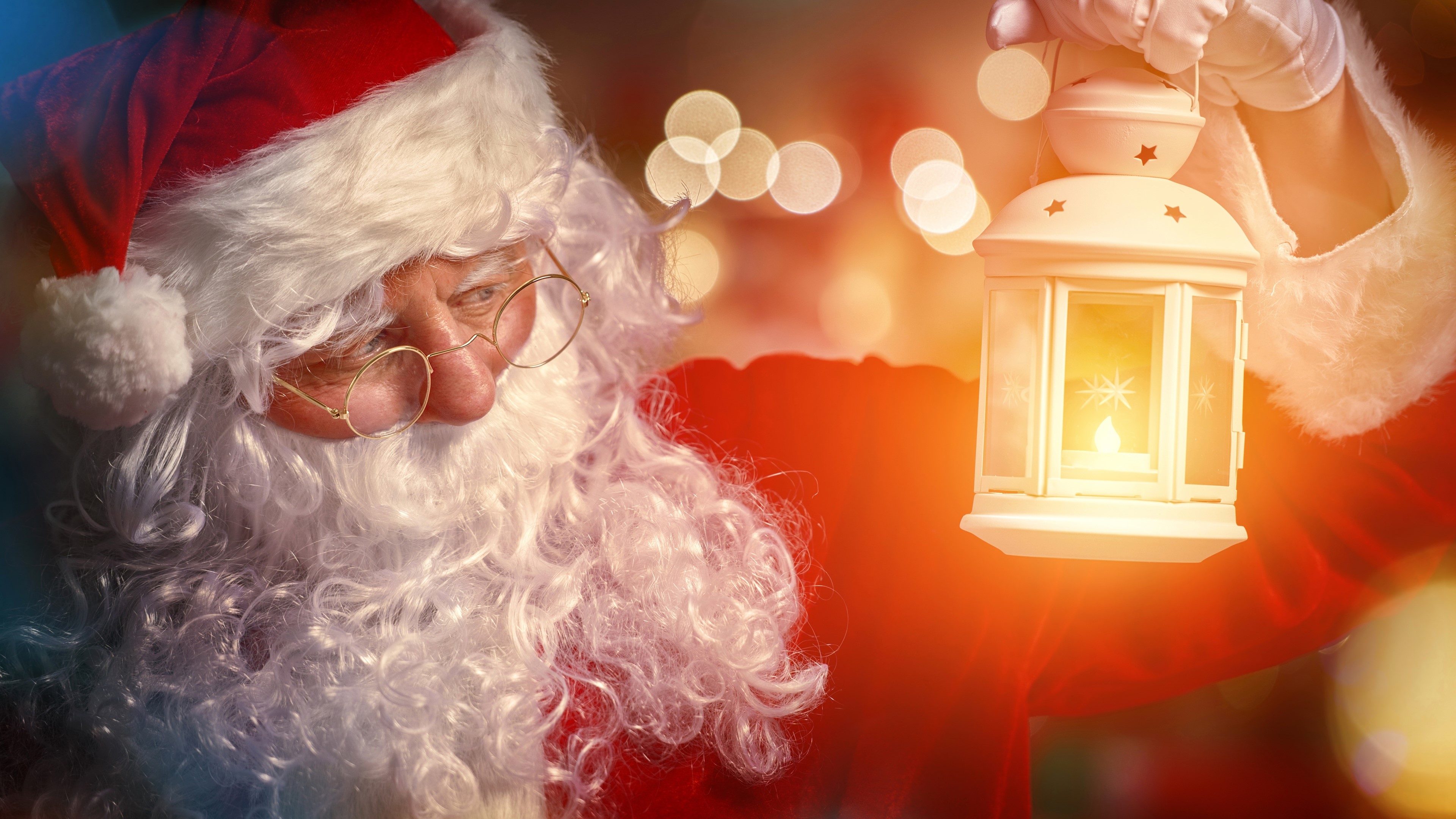 Santa Claus holding a lantern HD Wallpaper