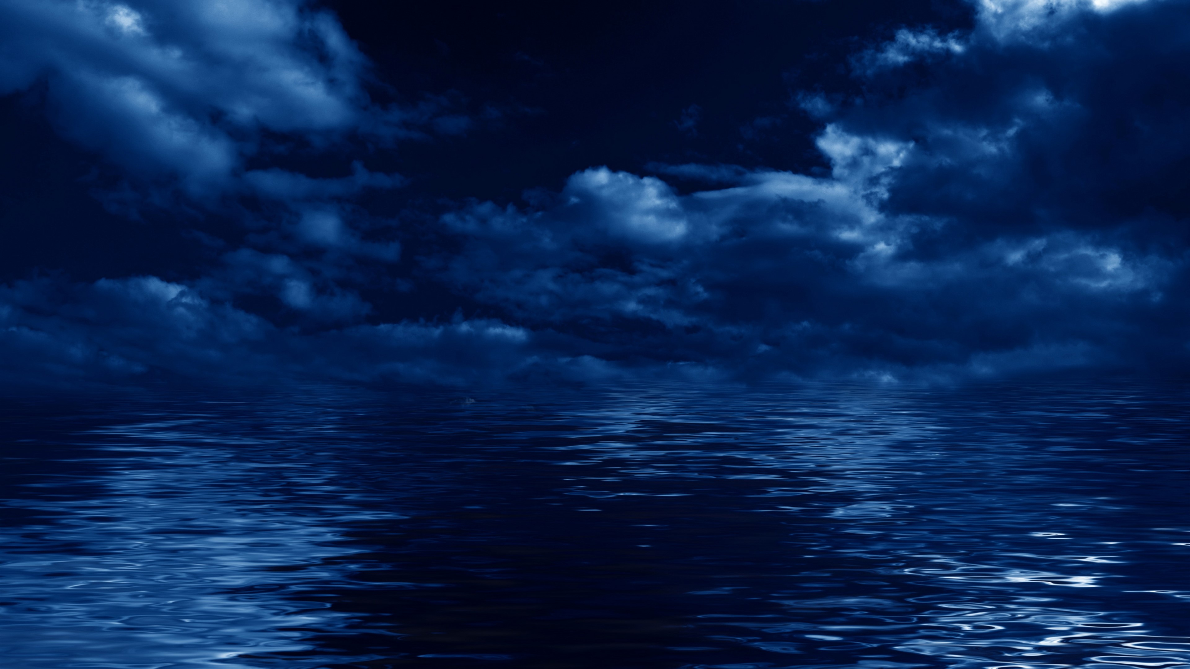 Dark Clouds Over Reflective Water HD Wallpaper