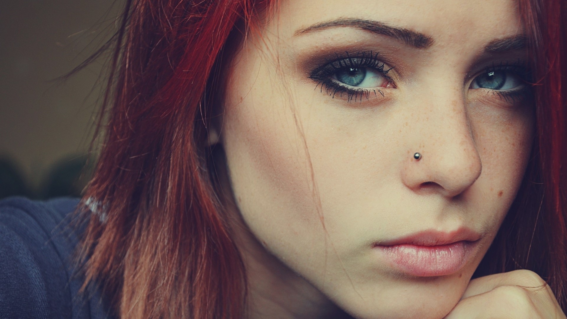 Close-up of a young woman with red hair and blue eyes HD Wallpaper