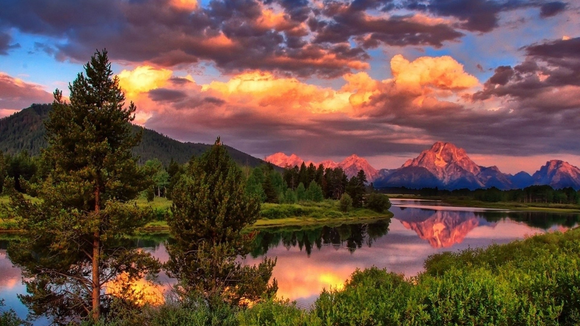 Sunset over mountains and lake with trees HD Wallpaper