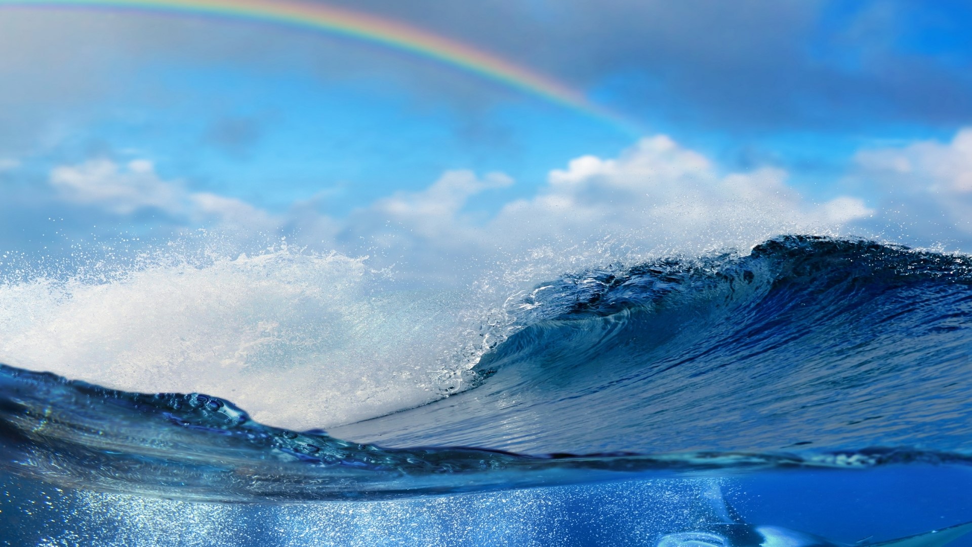 Ocean wave with rainbow and clouds HD Wallpaper