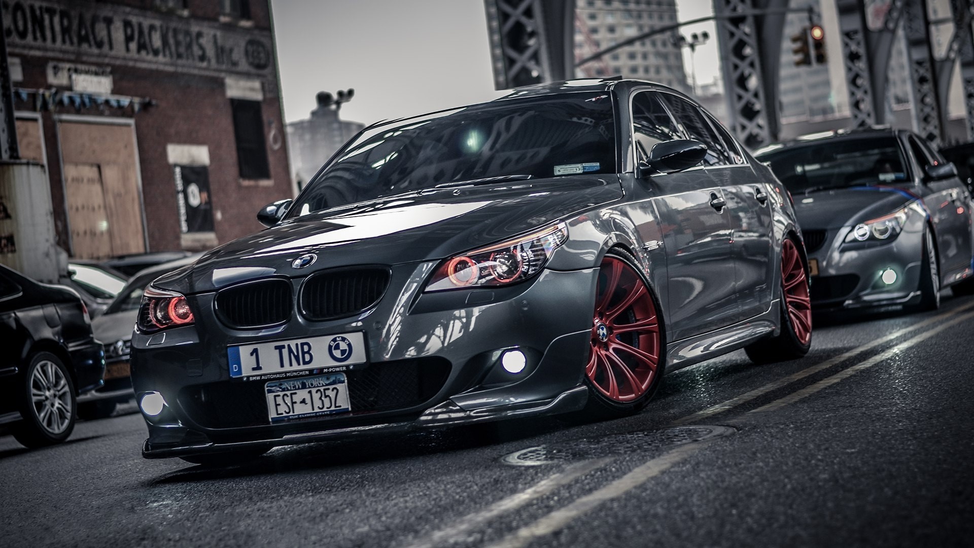 BMW M5 cars on a city street HD Wallpaper