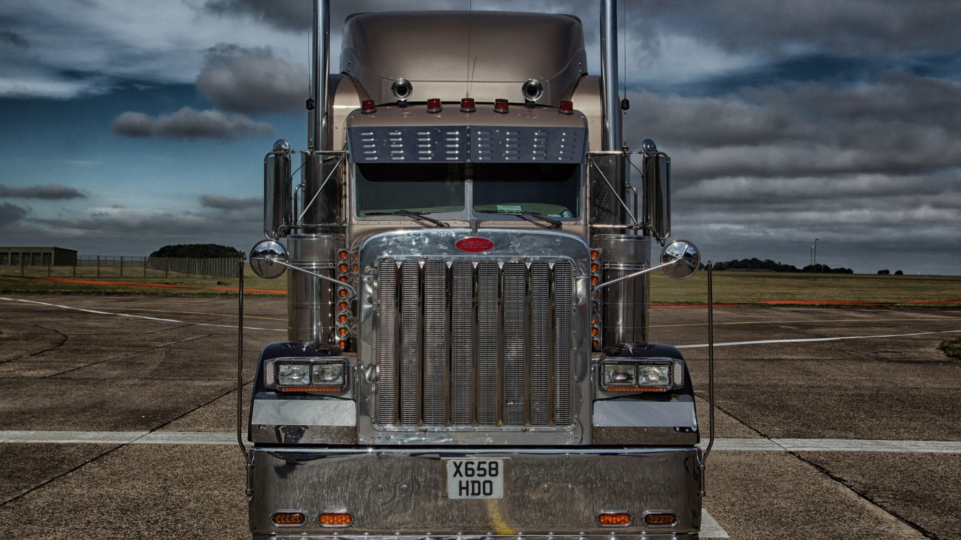Peterbilt truck on asphalt with cloudy sky HD Wallpaper