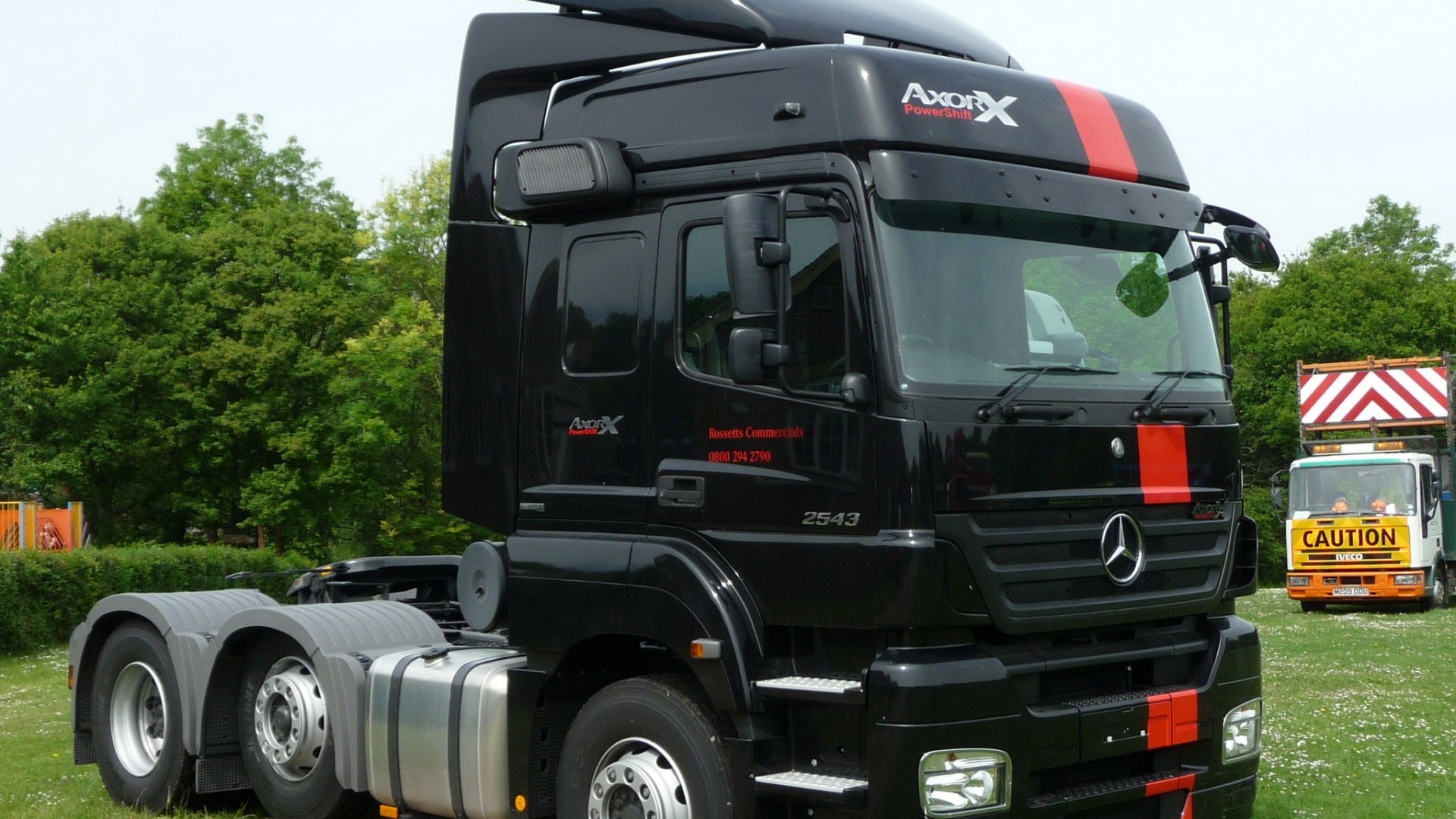 Black Mercedes Benz Axor tractor unit with red stripes HD Wallpaper