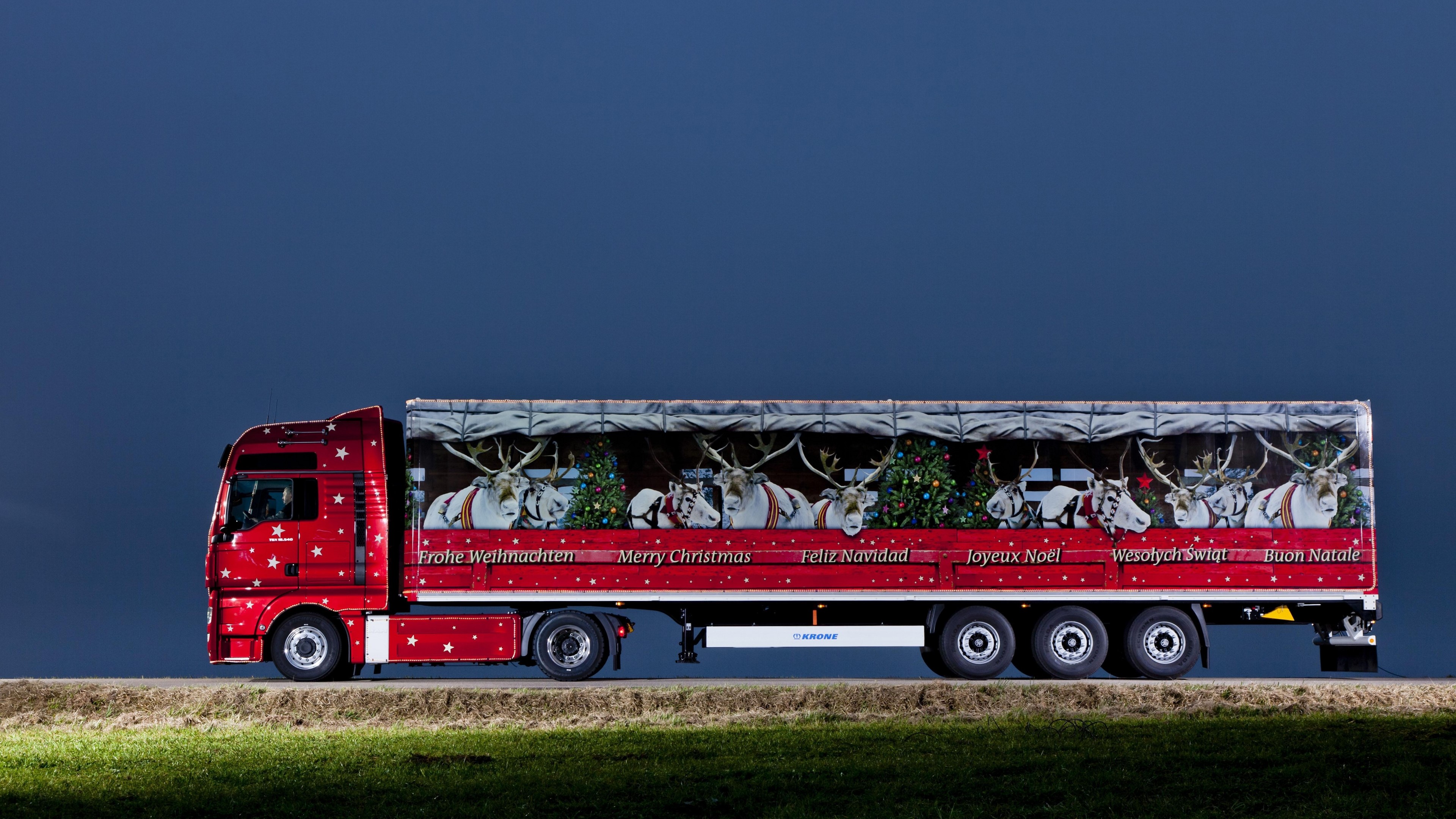 Red MAN SE Truck with Christmas Reindeer Decoration HD Wallpaper