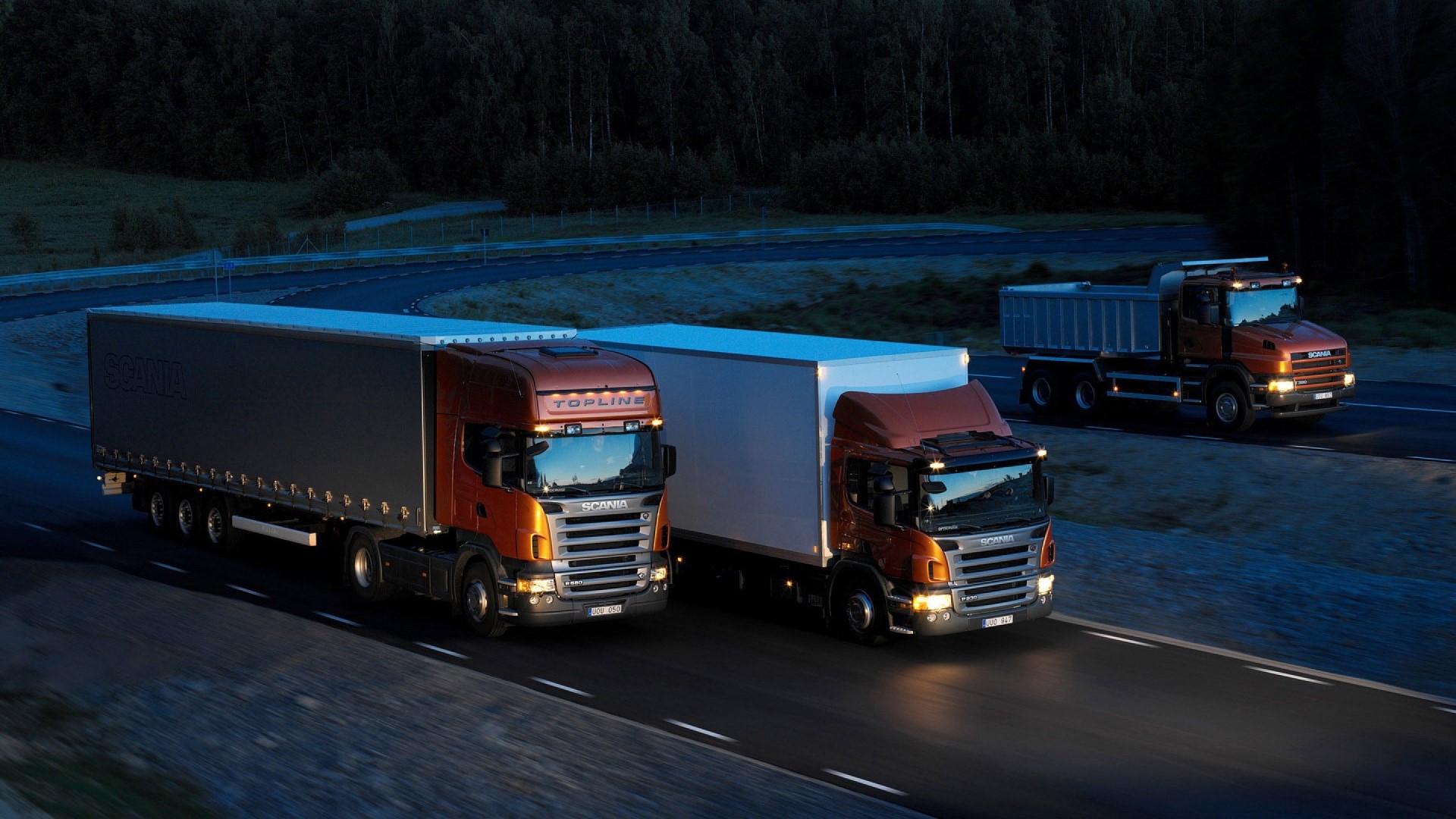 Scania Trucks on a Road at Night HD Wallpaper