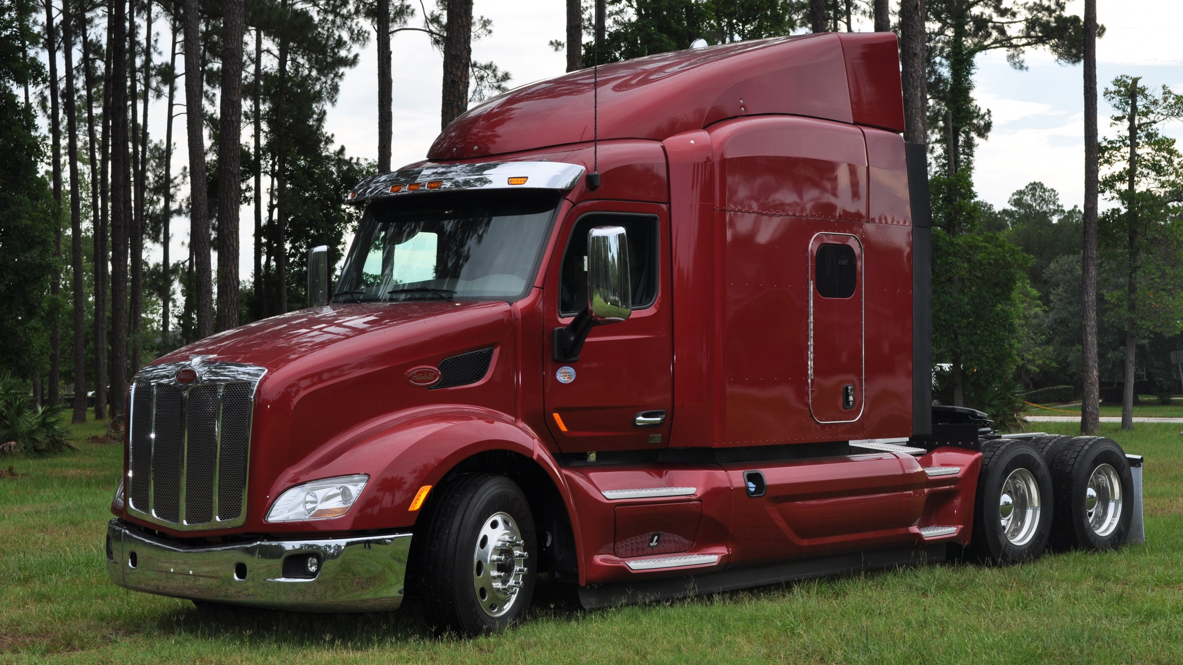 4K Peterbilt Semi-Truck in a Forest Setting HD Wallpaper