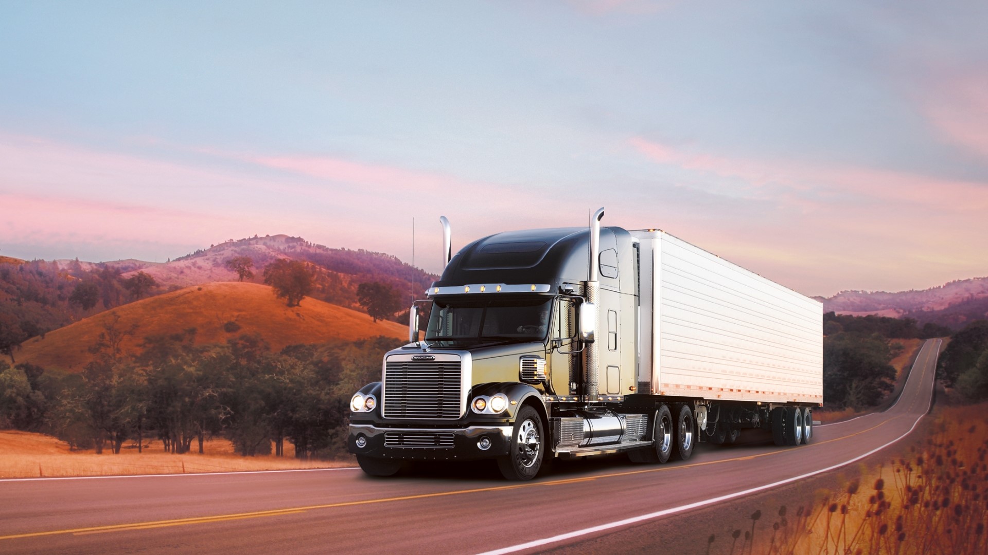 Freightliner Truck on a Winding Road at Sunset HD Wallpaper