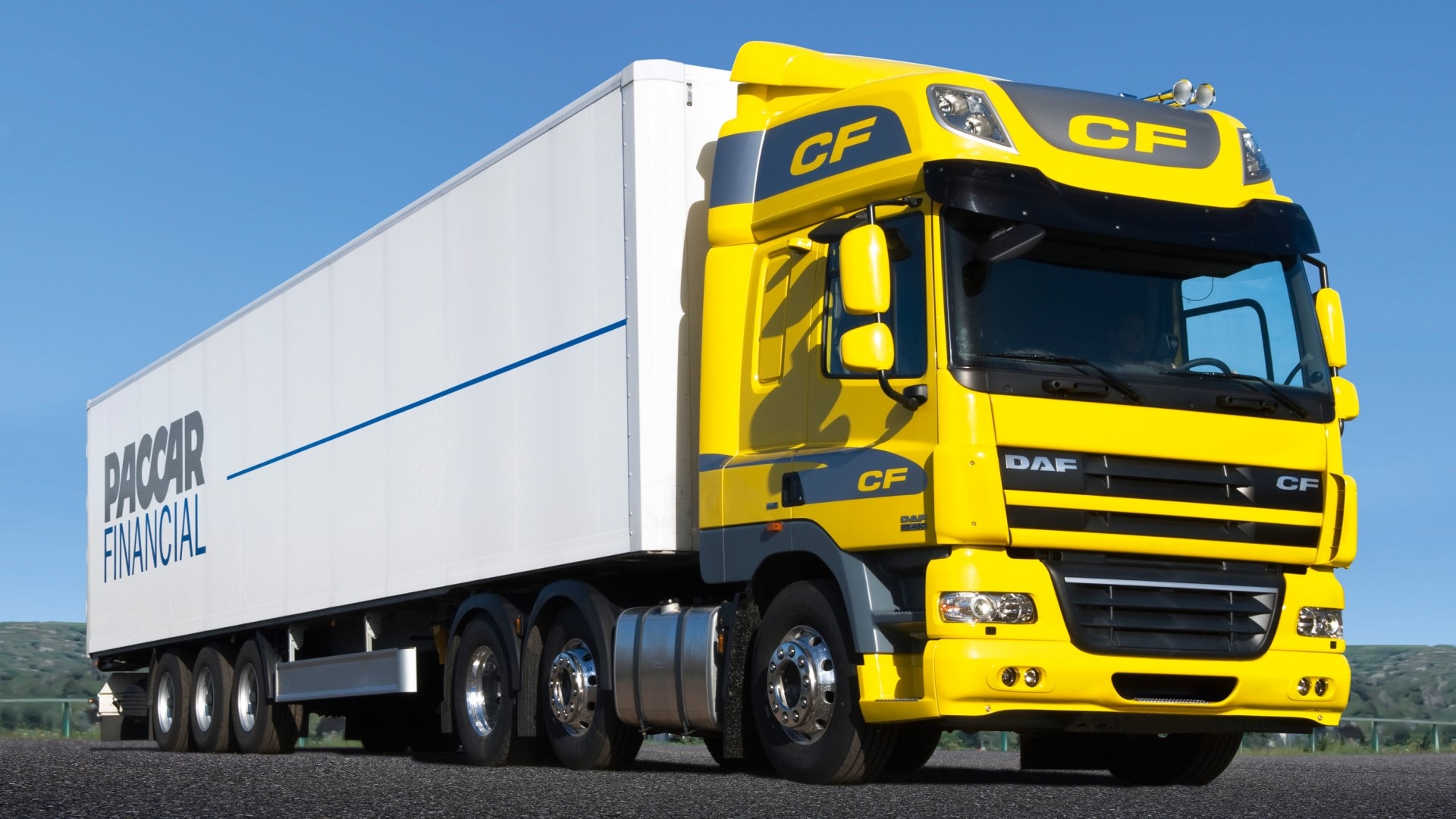 Yellow DAF CF Truck with PACCAR Financial Trailer HD Wallpaper