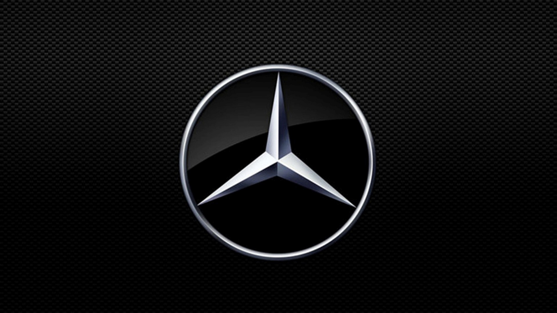 Mercedes Benz logo on black carbon fiber HD Wallpaper