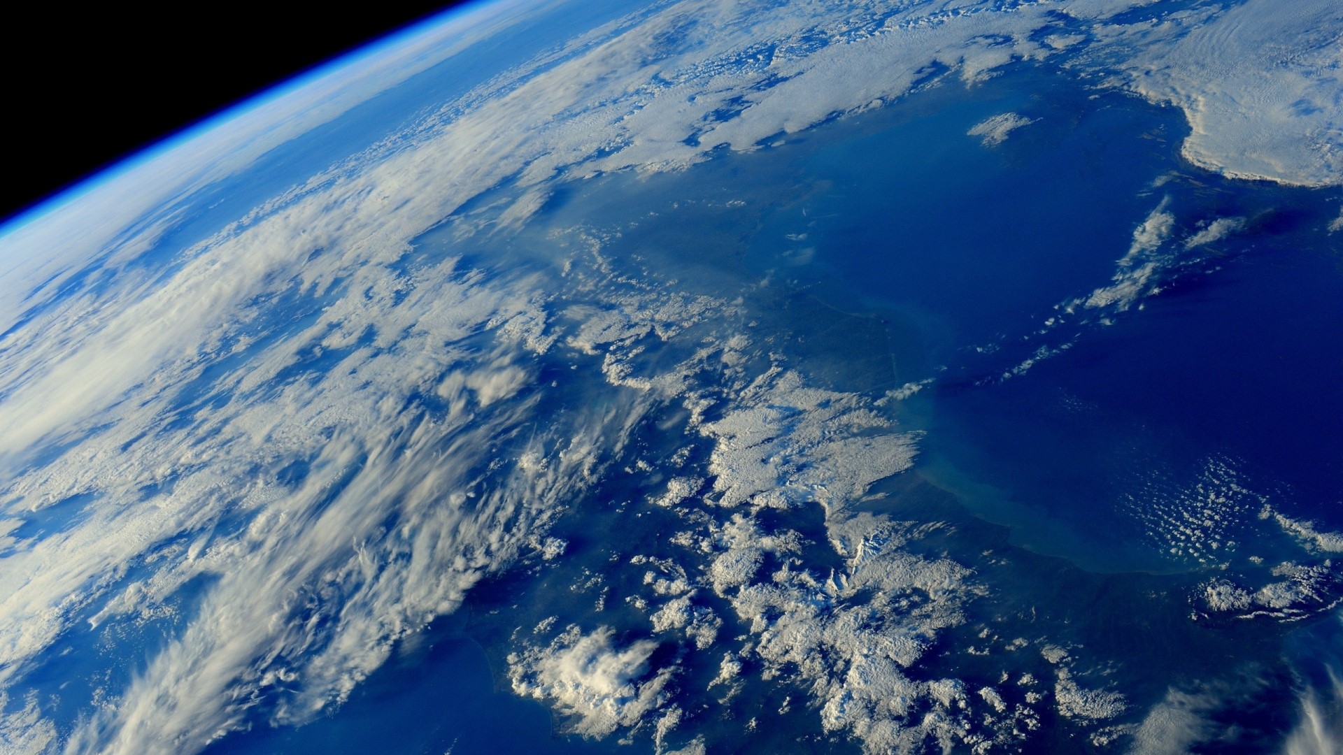 Earth from space with clouds and ocean HD Wallpaper