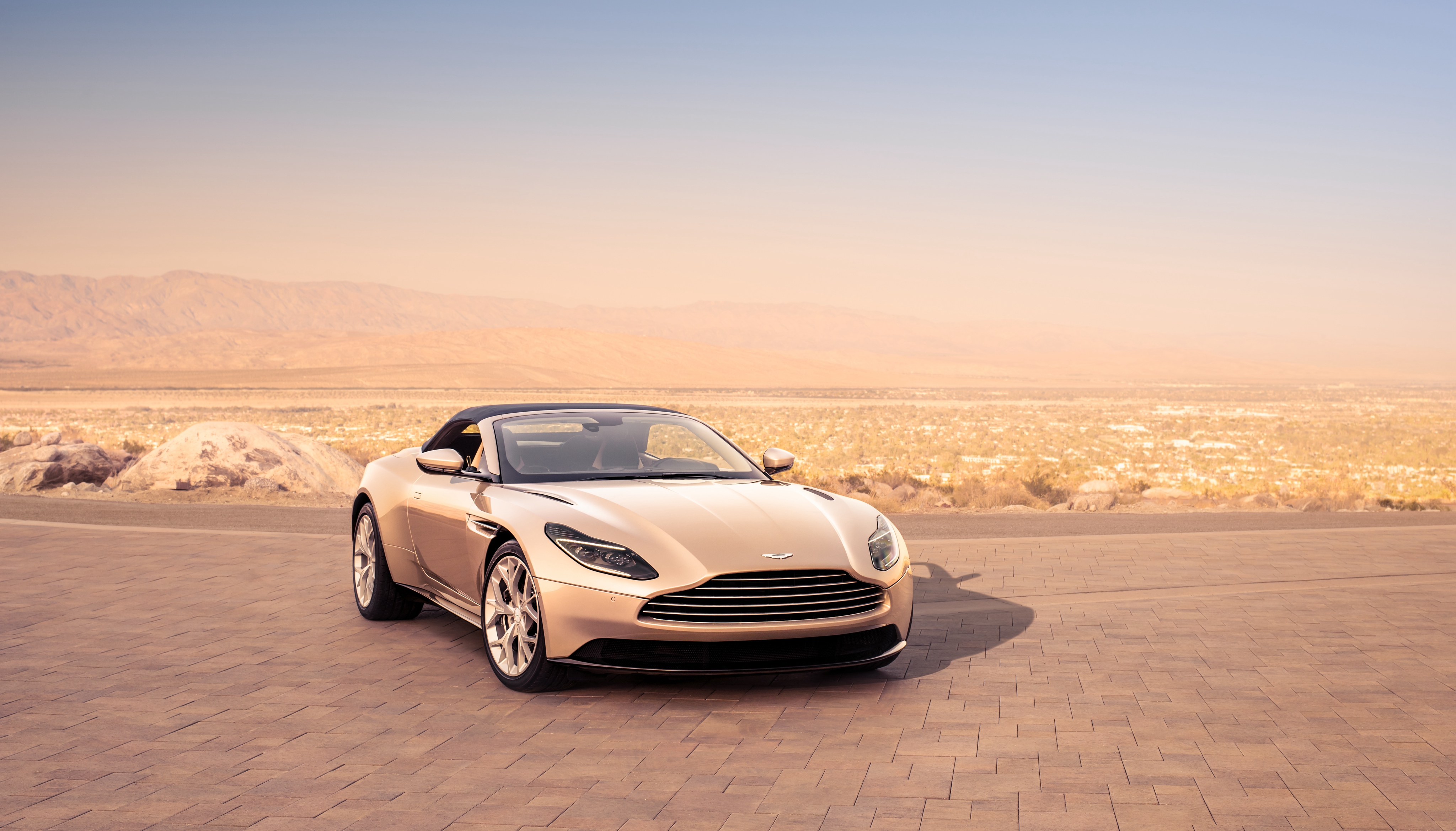 Aston Martin DB11 Volante convertible in desert landscape HD Wallpaper
