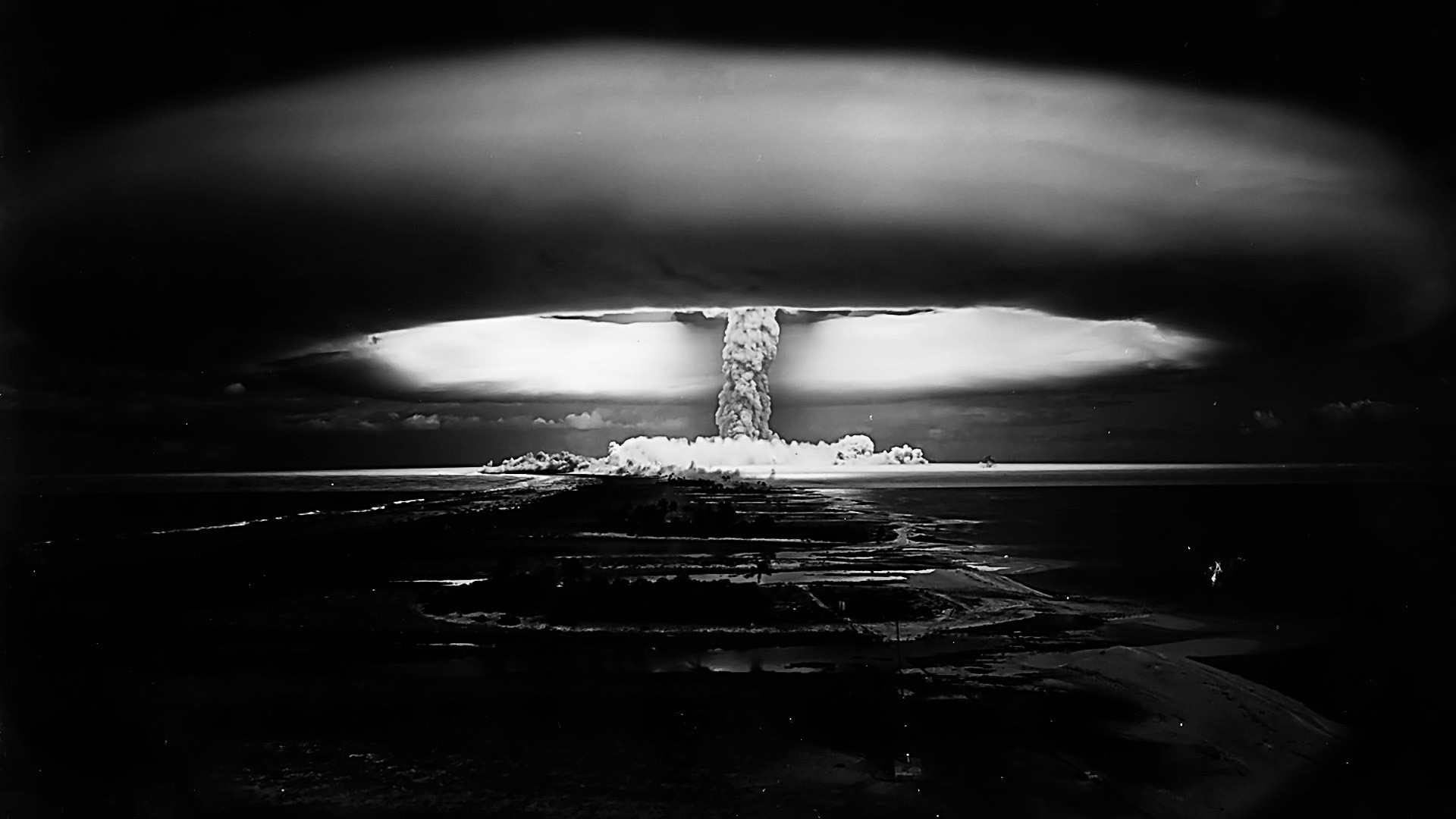 Nuclear explosion over ocean at night HD Wallpaper