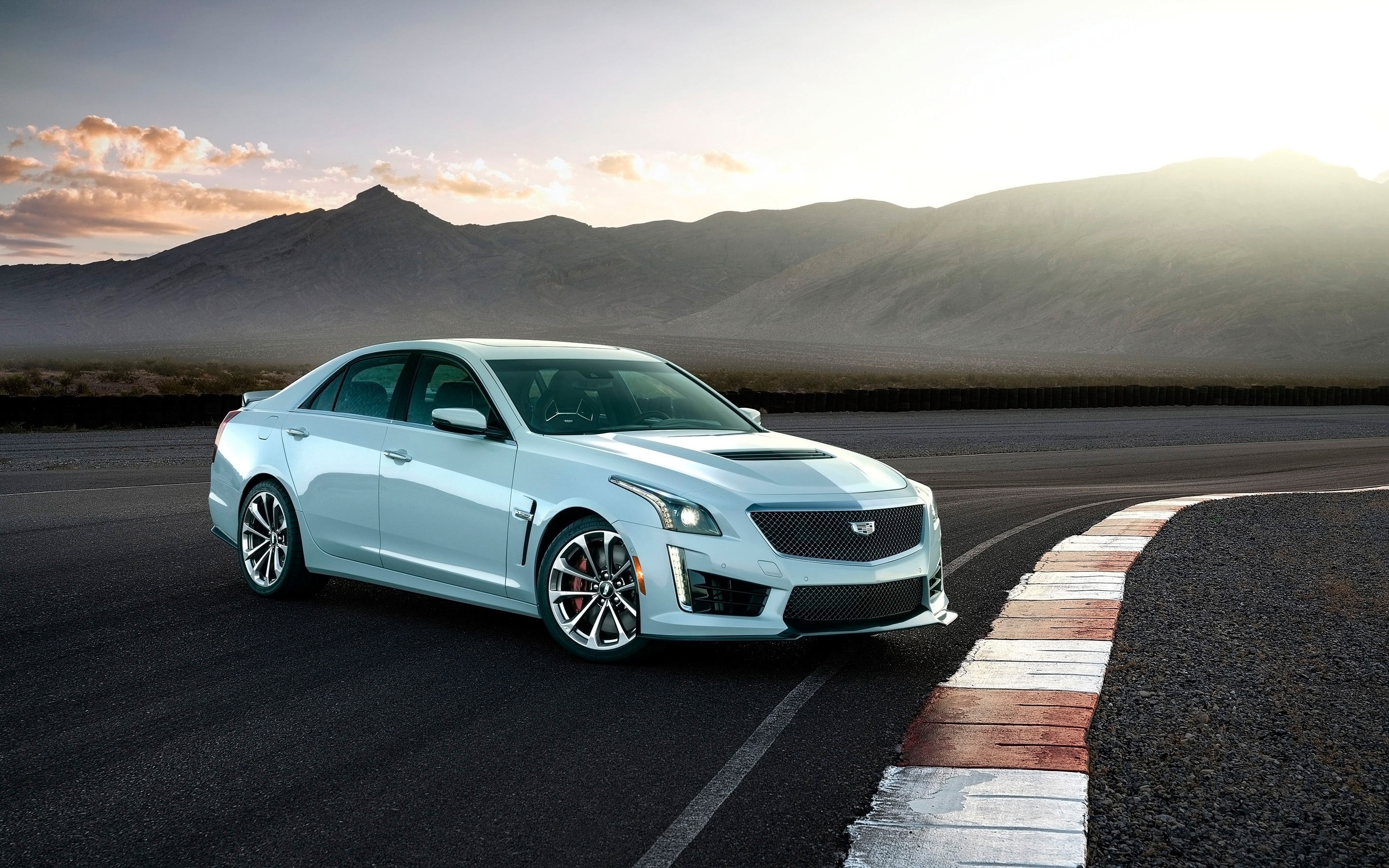Cadillac CTS-V Glacier Metallic Edition on a race track HD Wallpaper