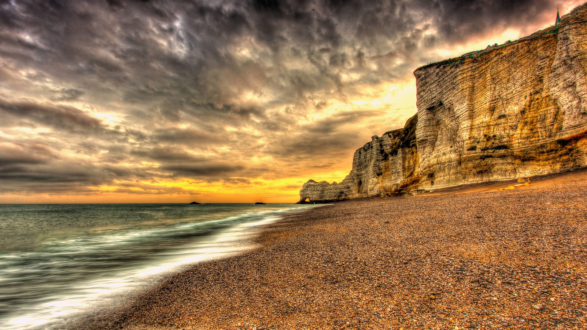 Beach with Cliffs and Ocean at Sunset HD Wallpaper