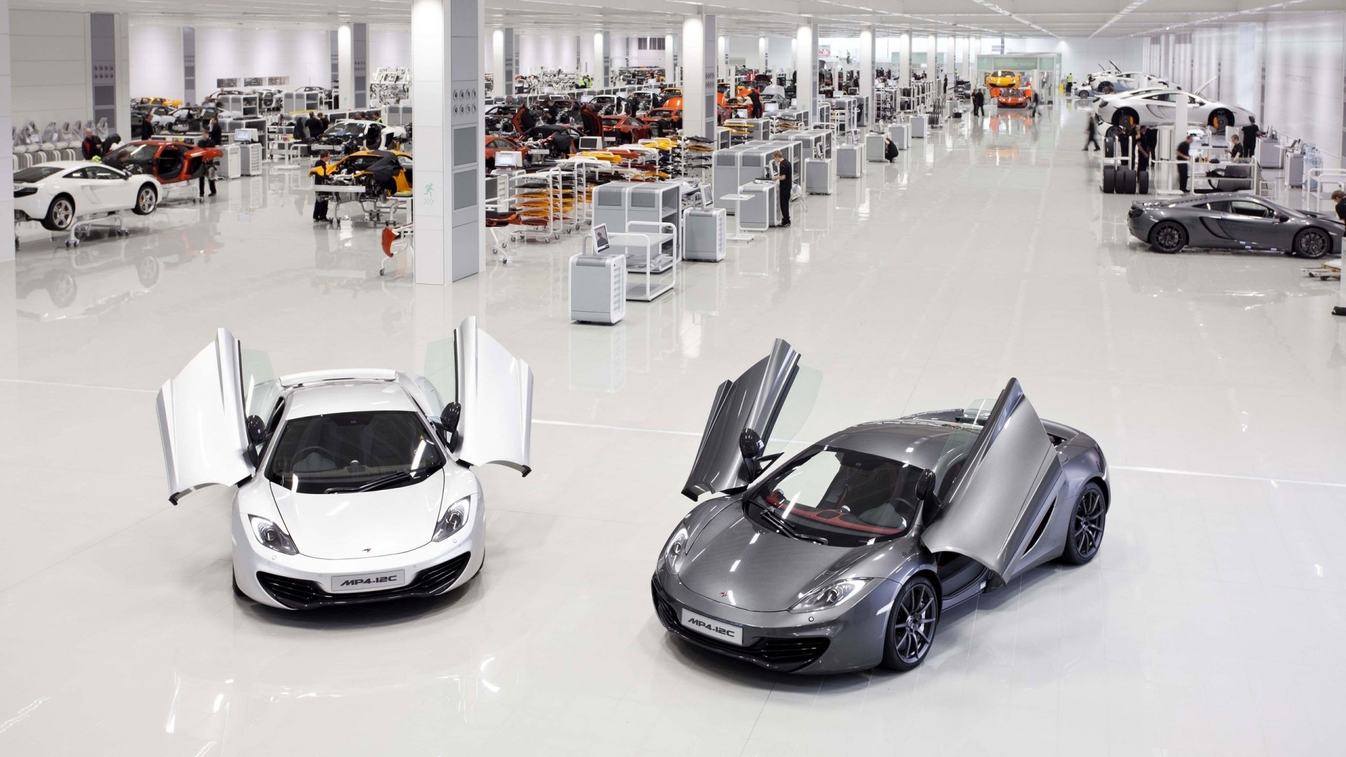 McLaren MP4-12C cars in a factory HD Wallpaper