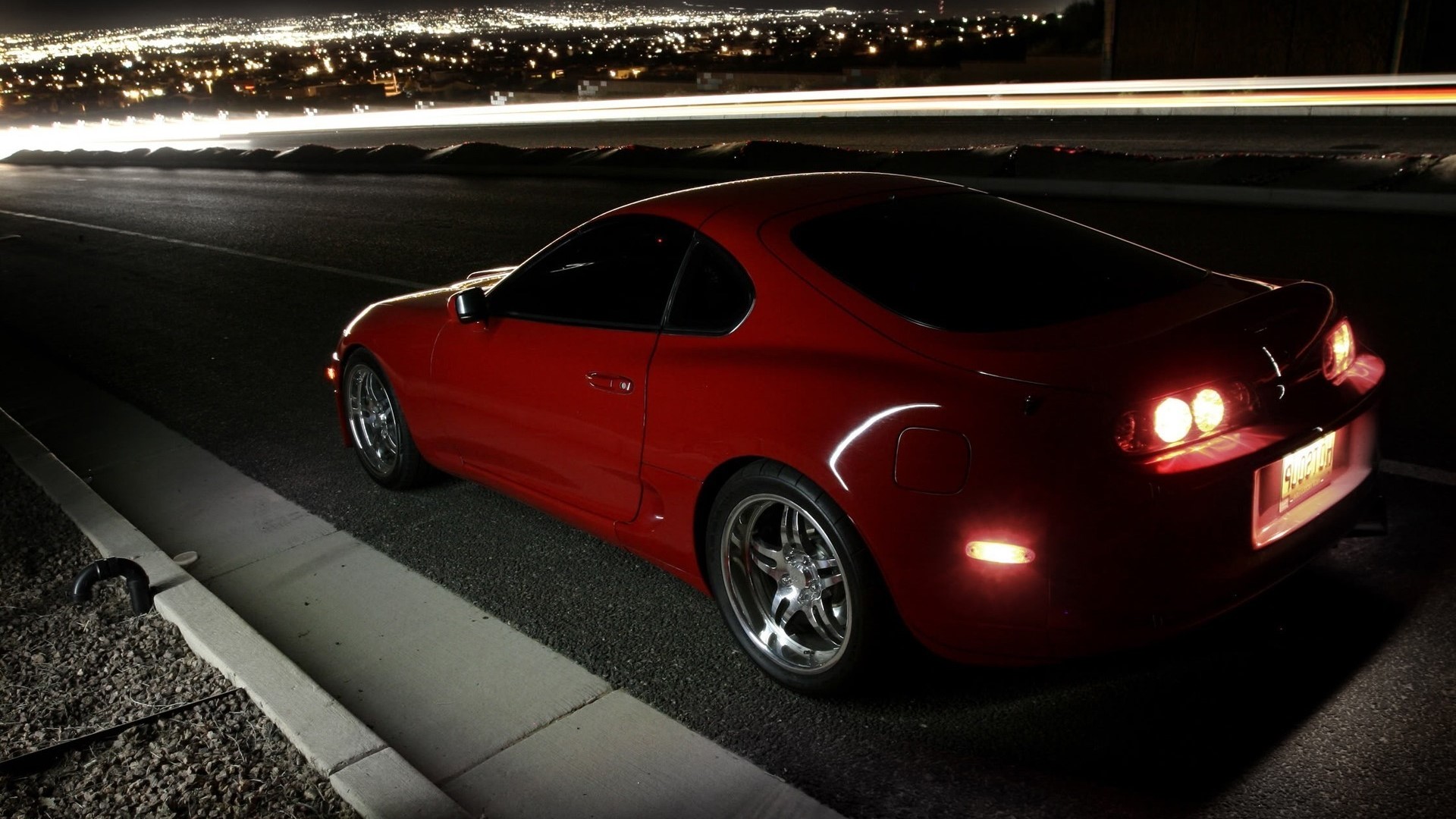 Red Toyota Supra on a road at night HD Wallpaper