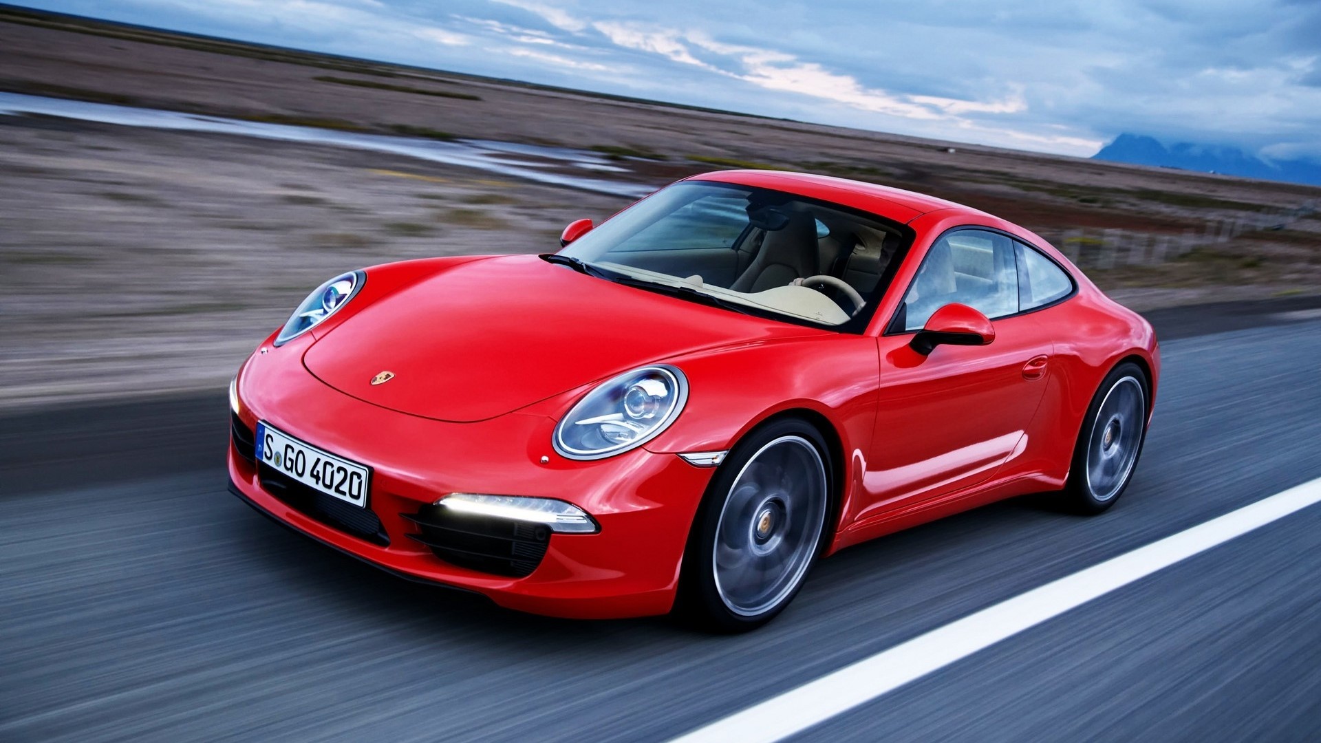 Red 2012 Porsche 911 Carrera driving on road HD Wallpaper