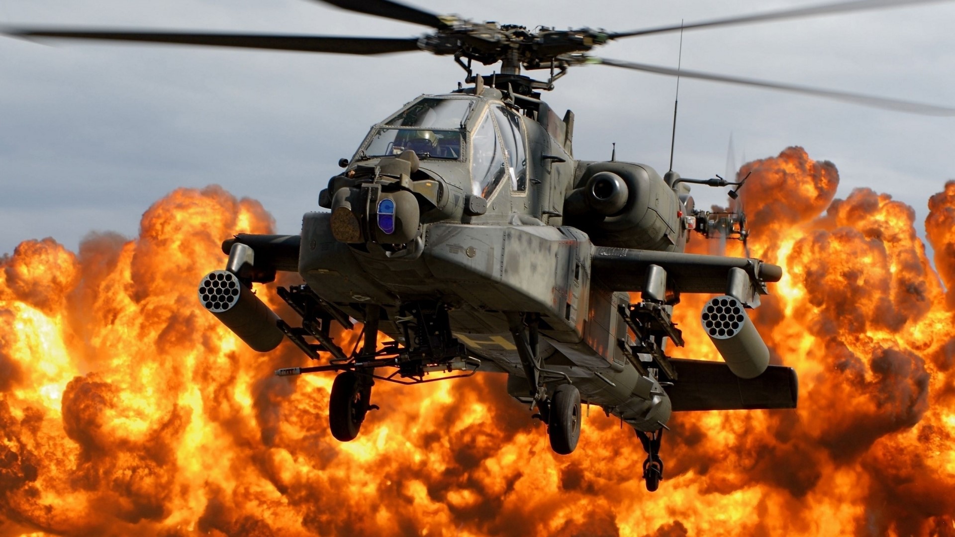AH-64 Apache helicopter in front of explosion HD Wallpaper