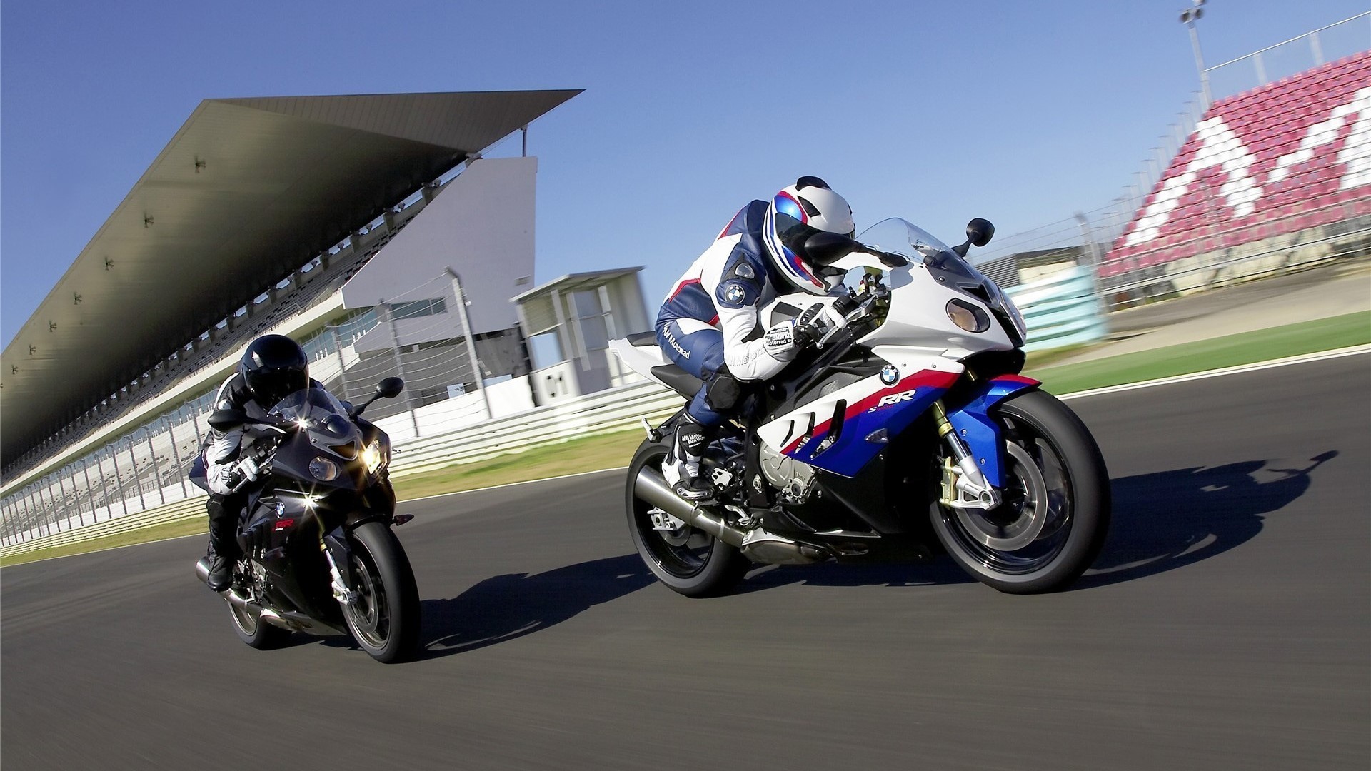 BMW Motorcycles Racing on a Track HD Wallpaper