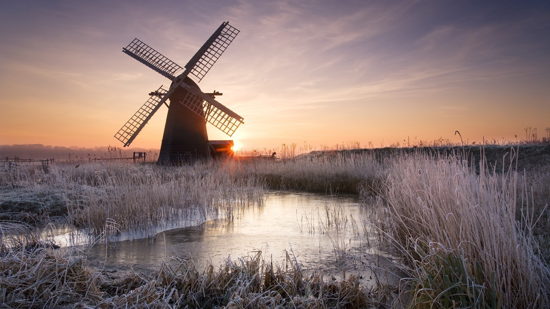 Winter windmill at sunrise with frozen pond HD Wallpaper
