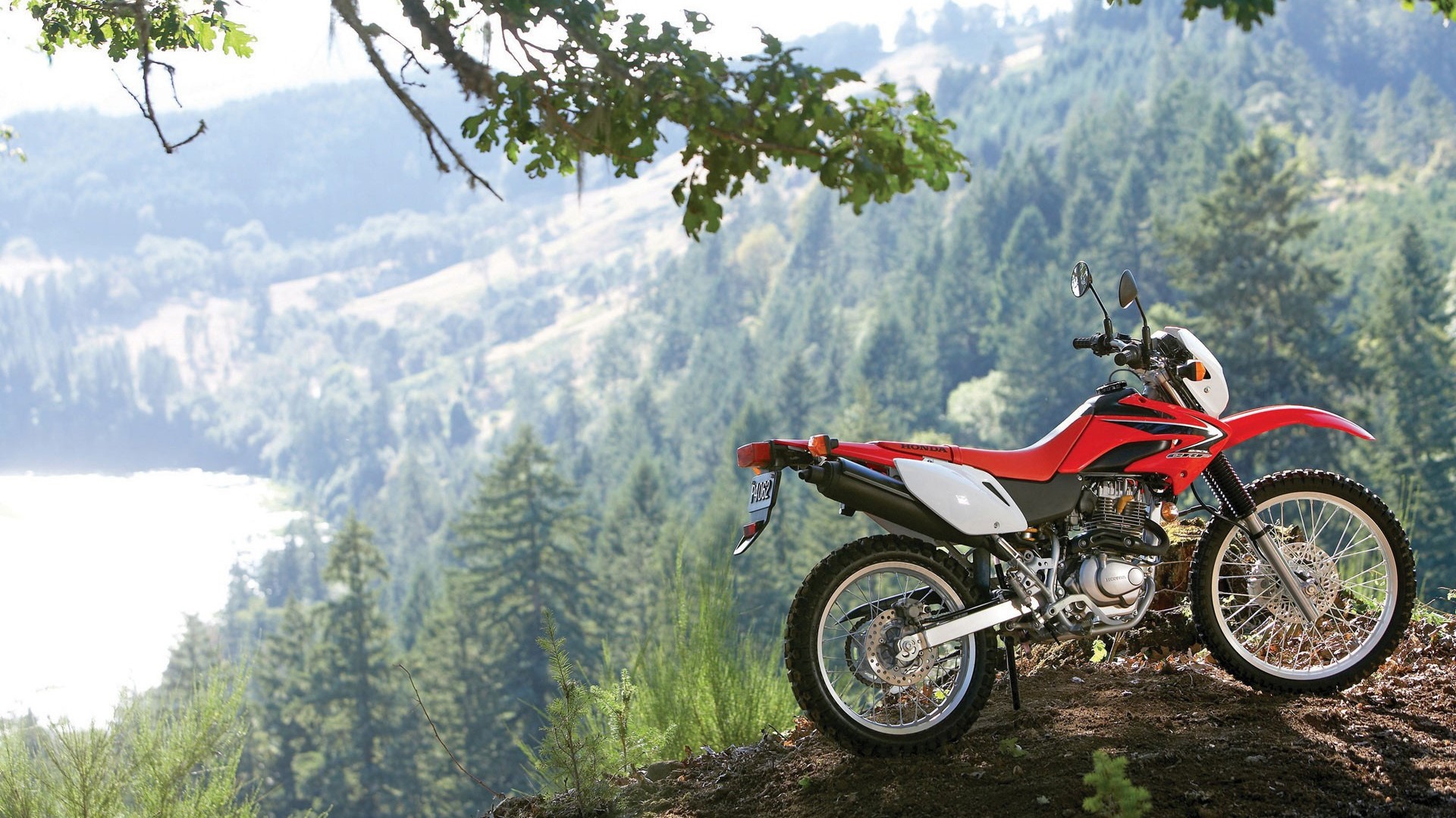 Red Honda Dirt Bike on a Mountain Overlook HD Wallpaper