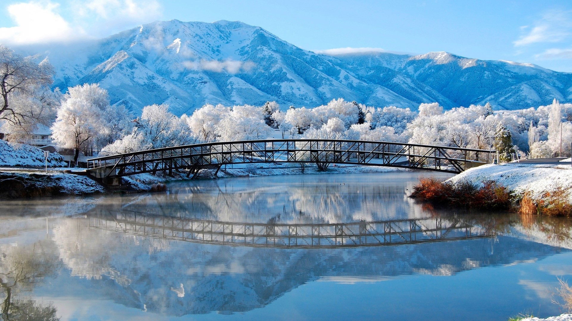 Snowy Winter Landscape with Bridge and Mountains HD Wallpaper