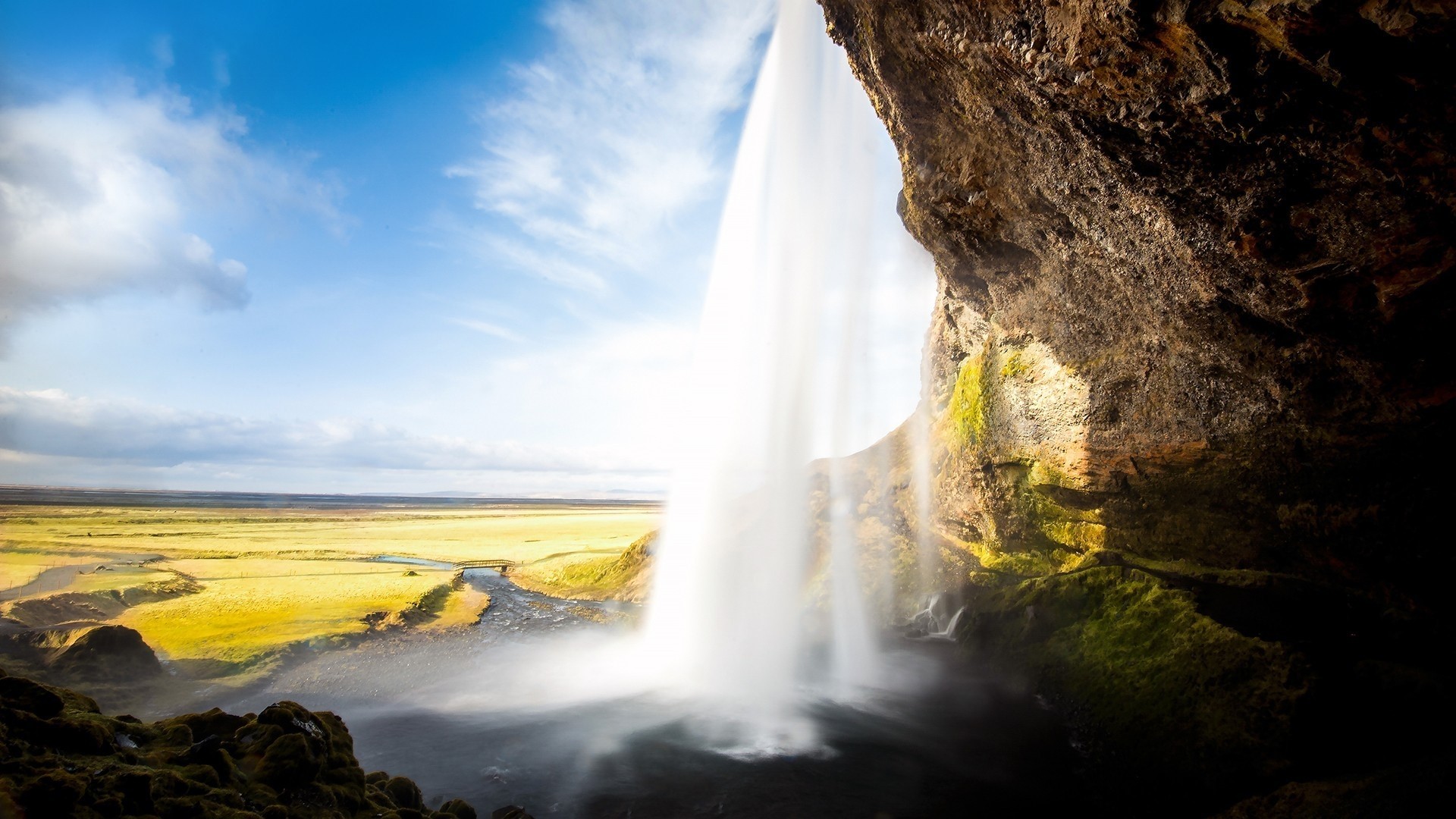 Waterfall in a green valley under a blue sky HD Wallpaper