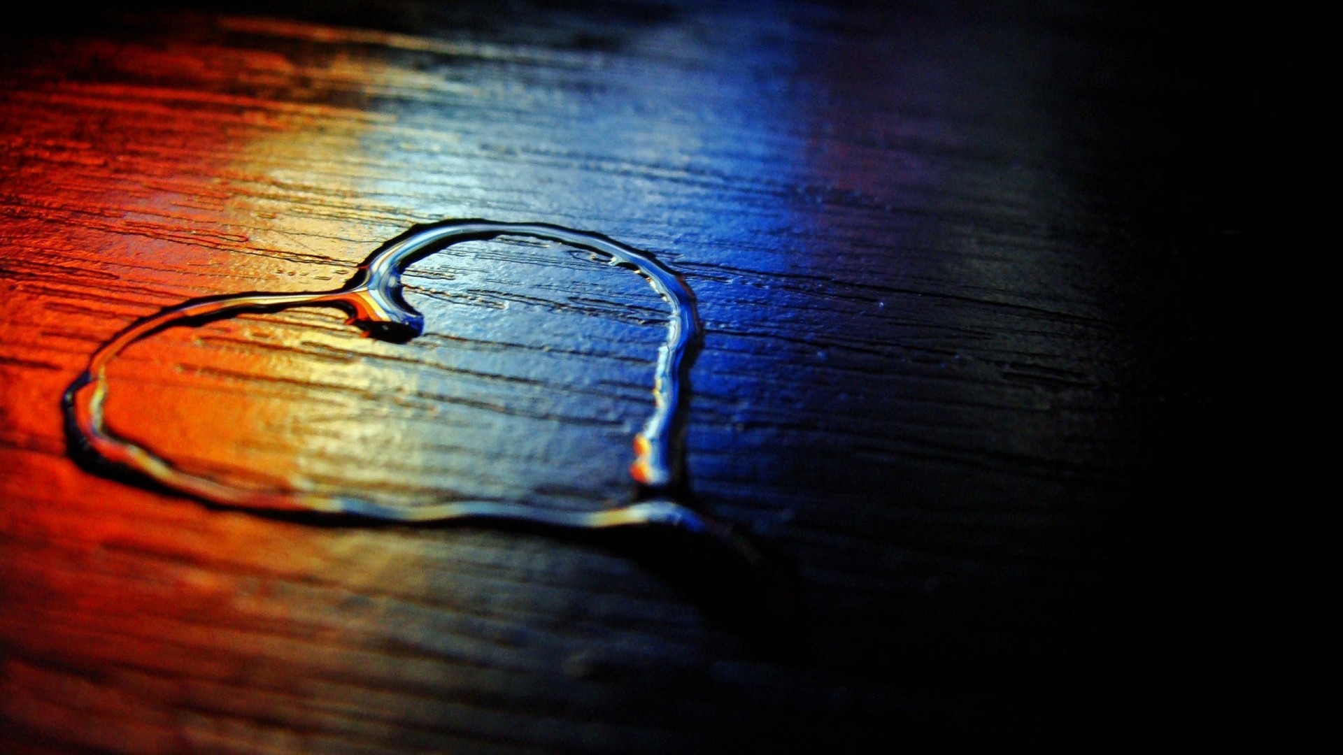 Heart shape made of water on a wooden surface HD Wallpaper