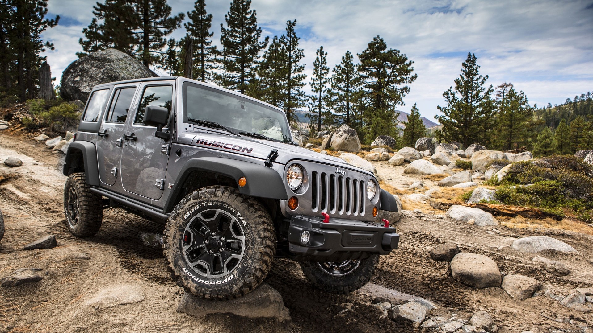 Silver Jeep Rubicon off-roading on rocky terrain HD Wallpaper