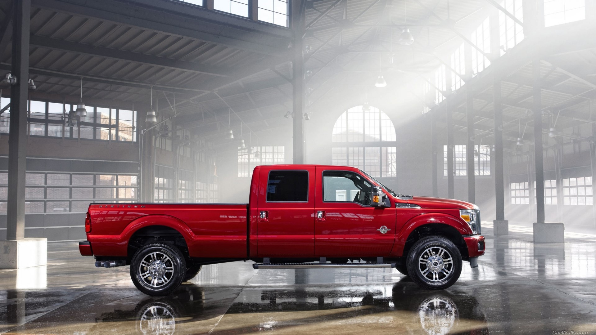 Red Ford Super Duty Platinum truck in warehouse HD Wallpaper