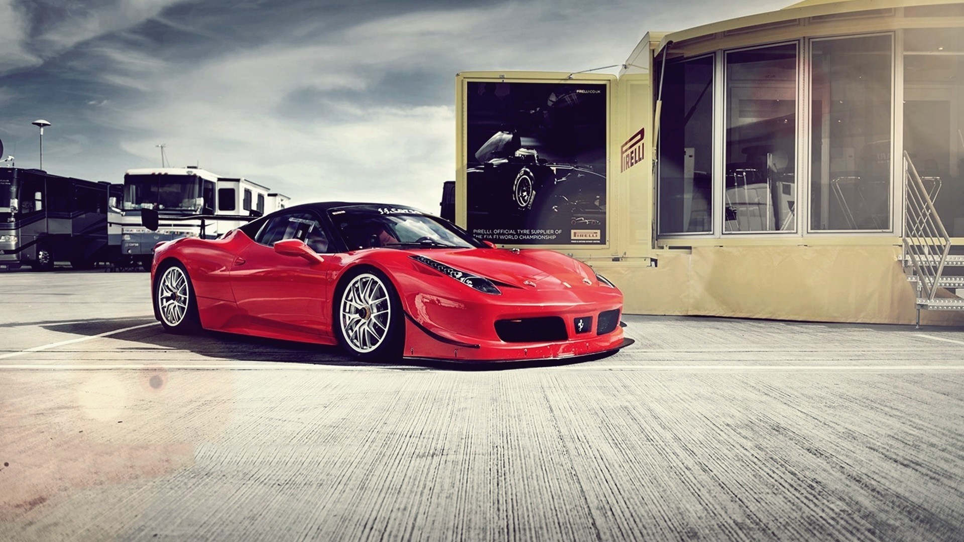 Red Ferrari 458 Italia with Pirelli advertisement HD Wallpaper
