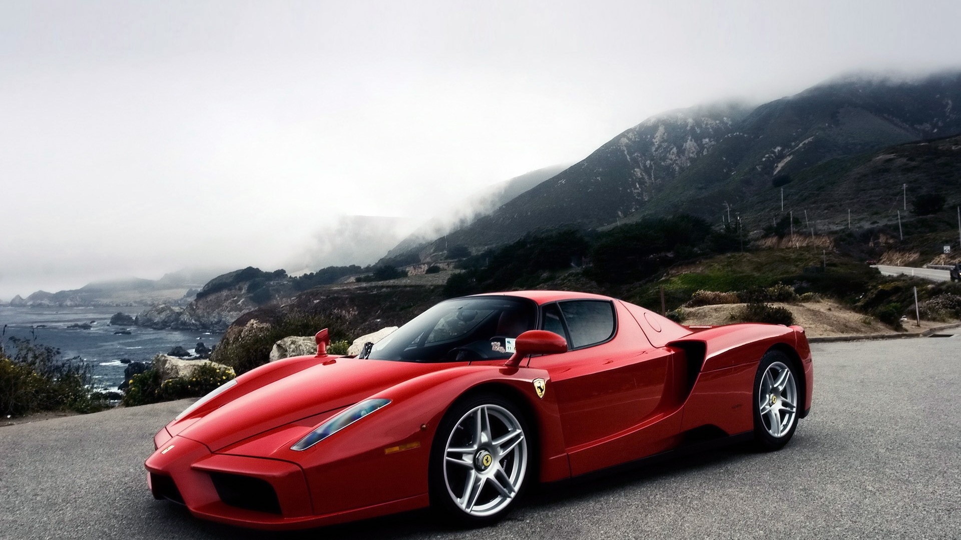 Red Ferrari Enzo on a Coastal Road HD Wallpaper