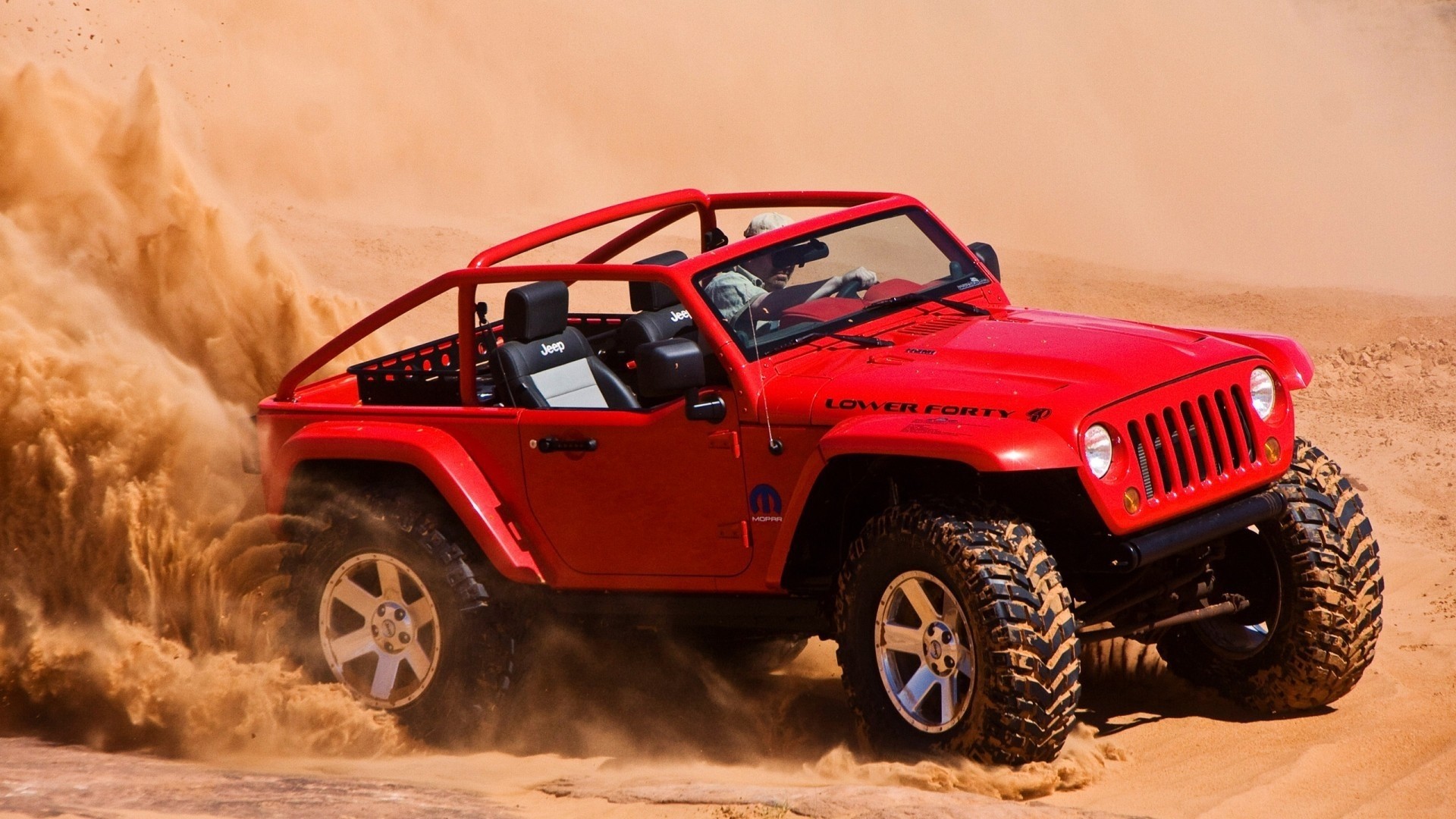 Red Jeep Lower Forty Concept driving through sand HD Wallpaper