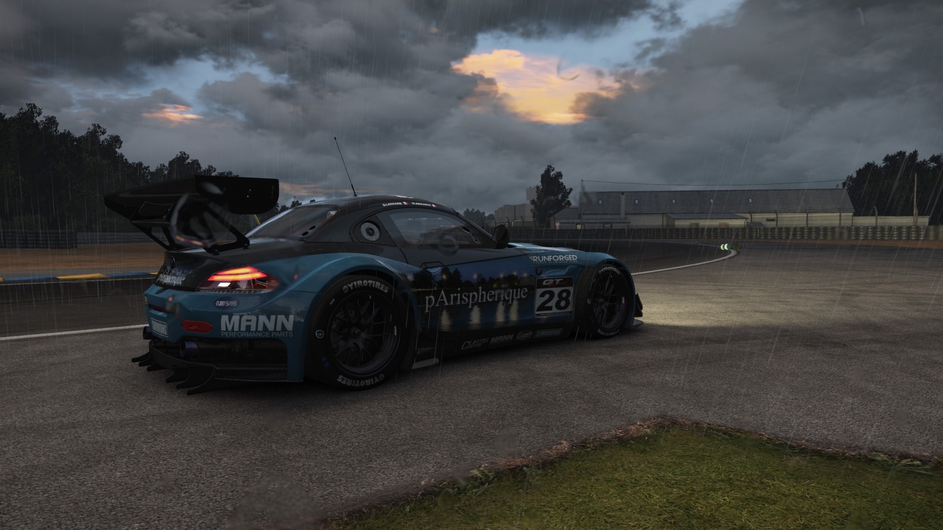 Race car on a wet track during a storm HD Wallpaper