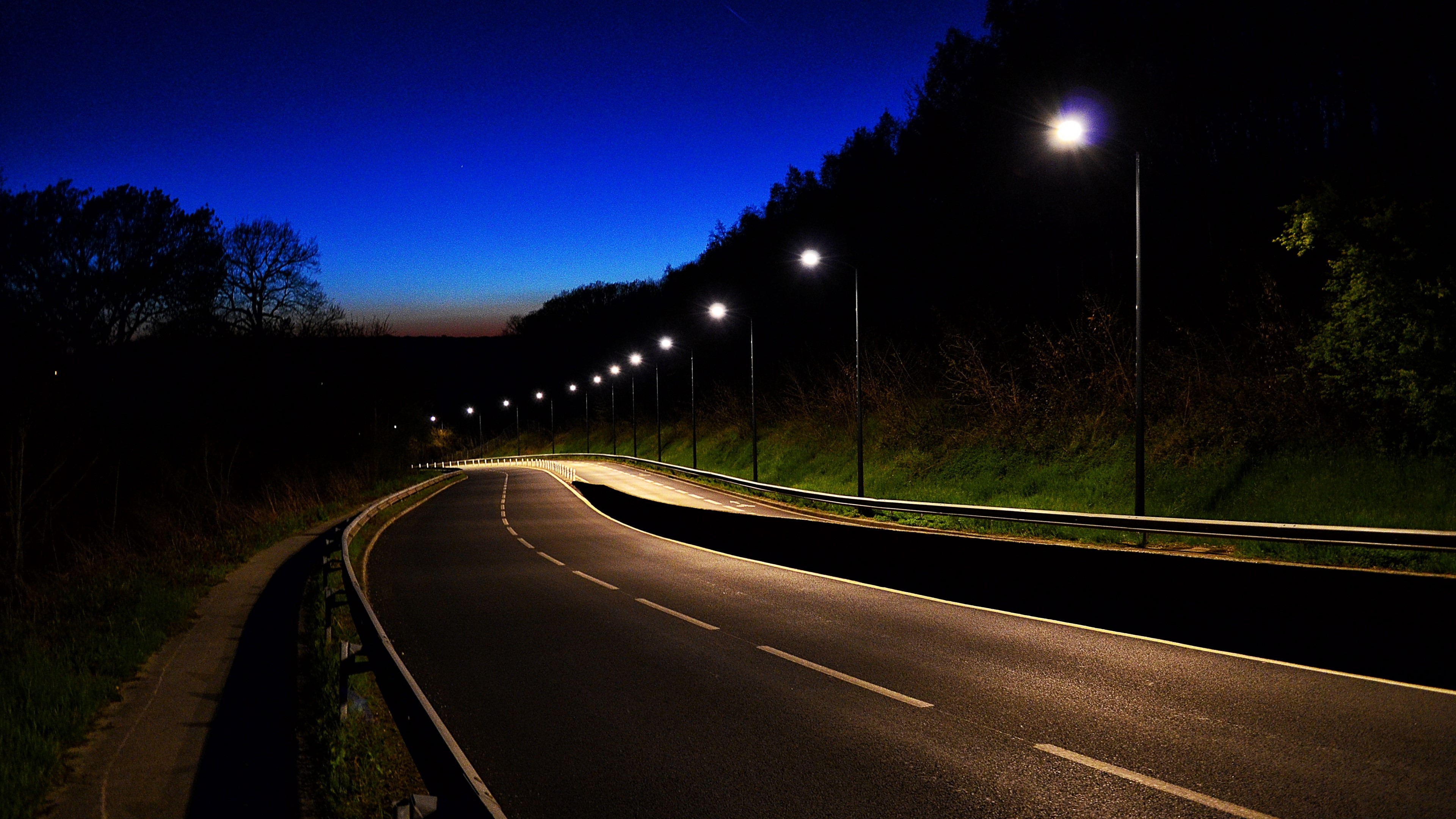 Road at night with streetlights HD Wallpaper